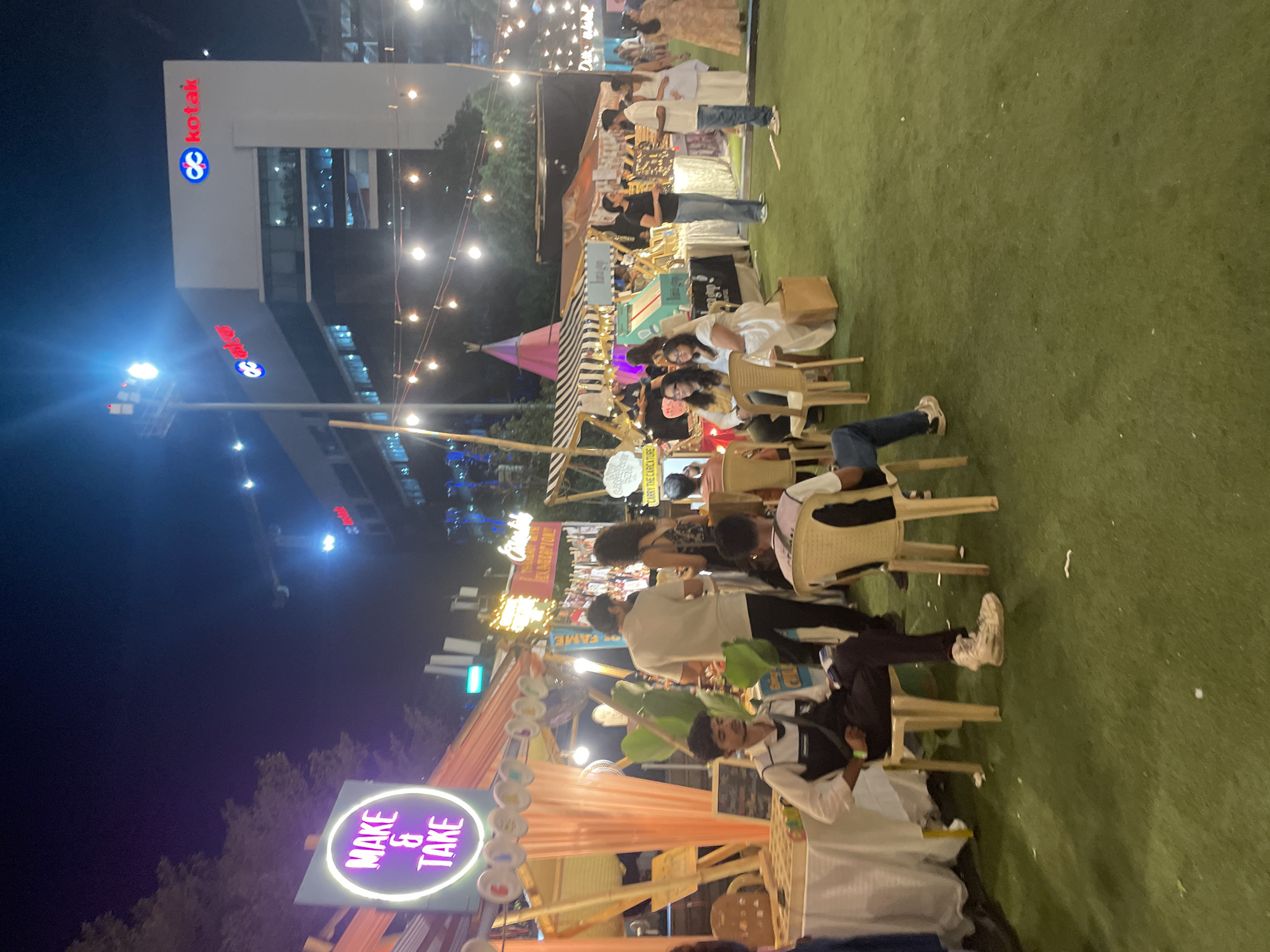 Night jewelry vendor operates illuminated market stall in Mumbai