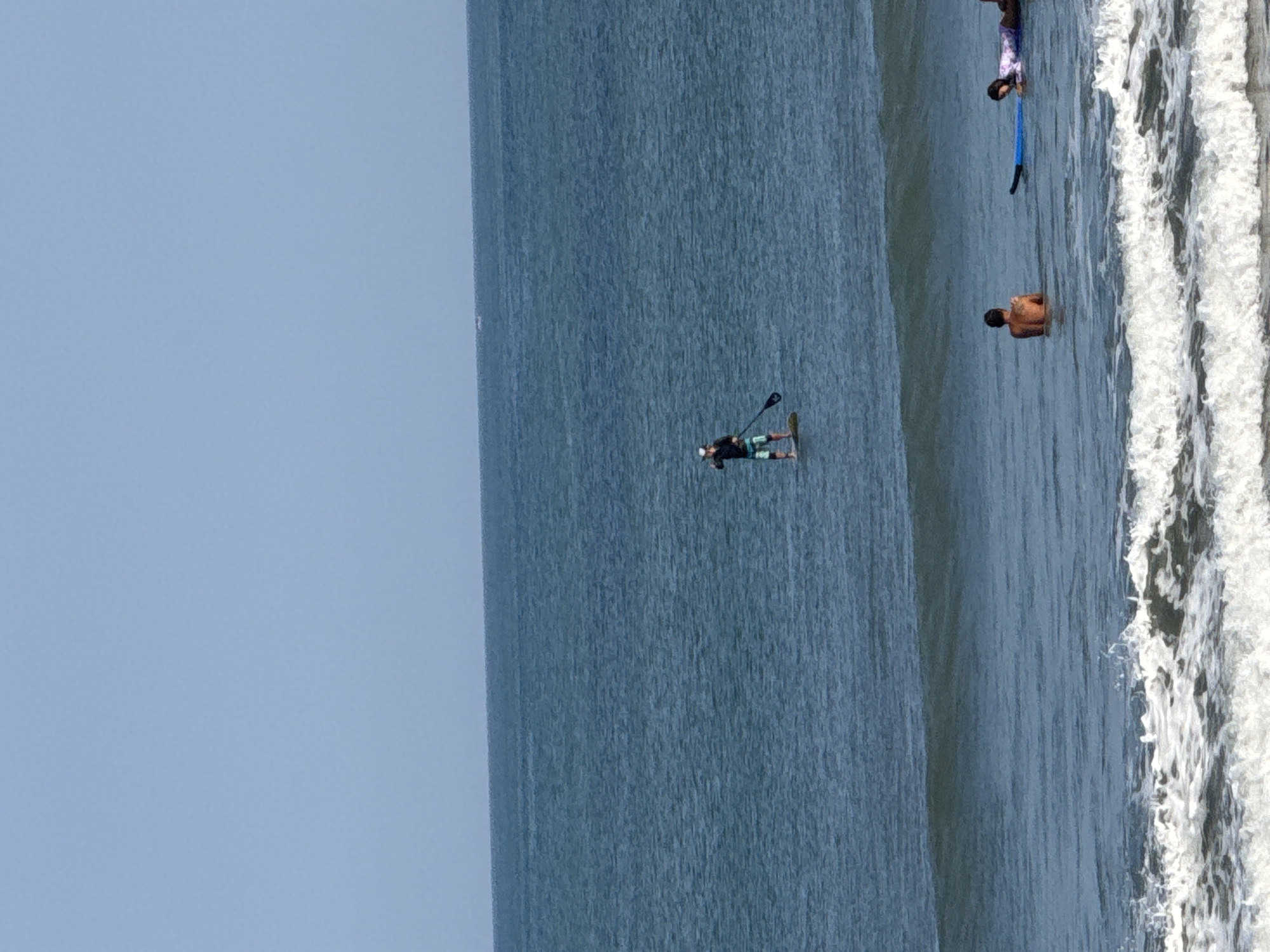 Surf session underway at Kuta Beach, Bali