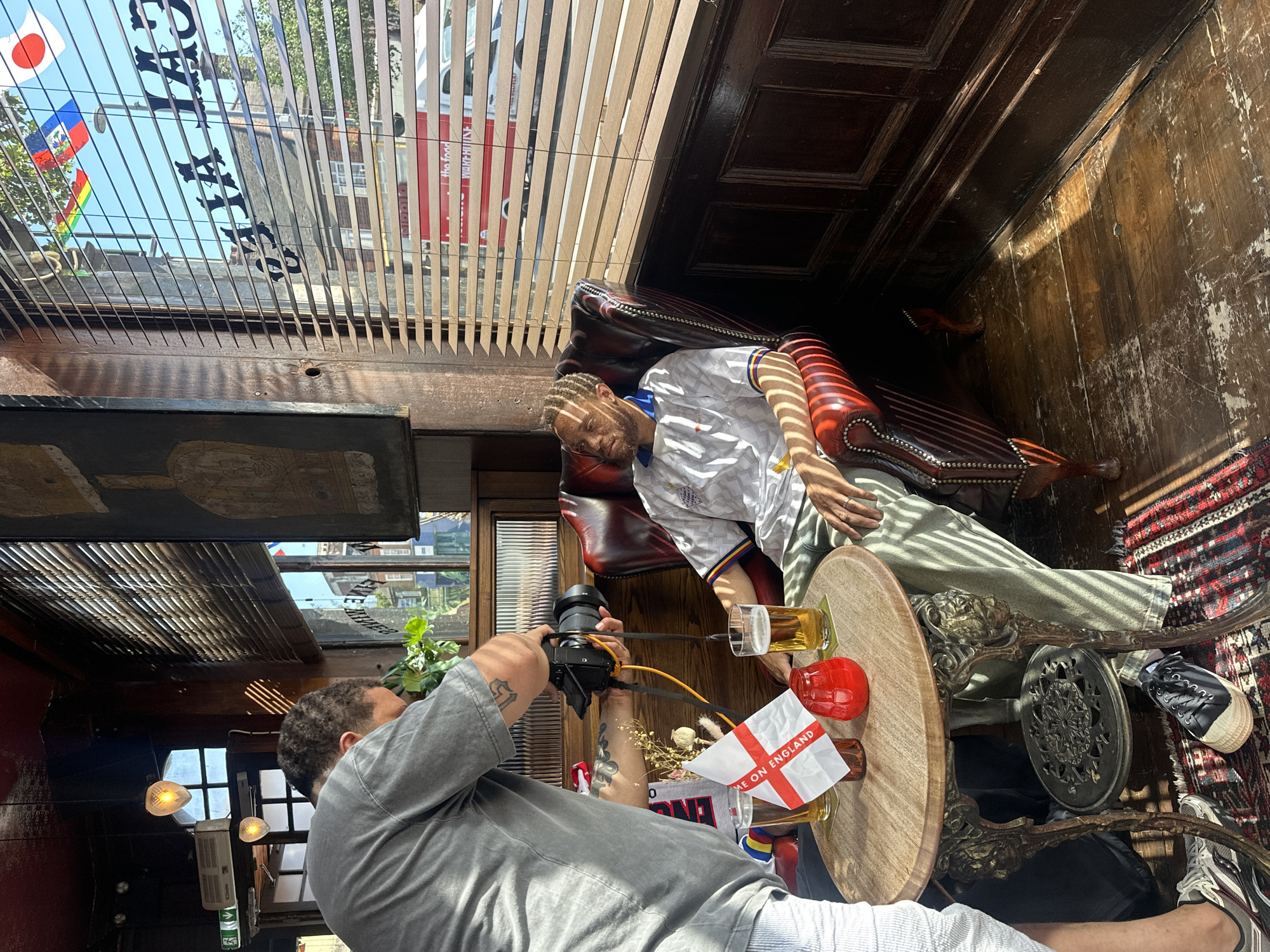 Man photographs England shirt mannequin in London pub