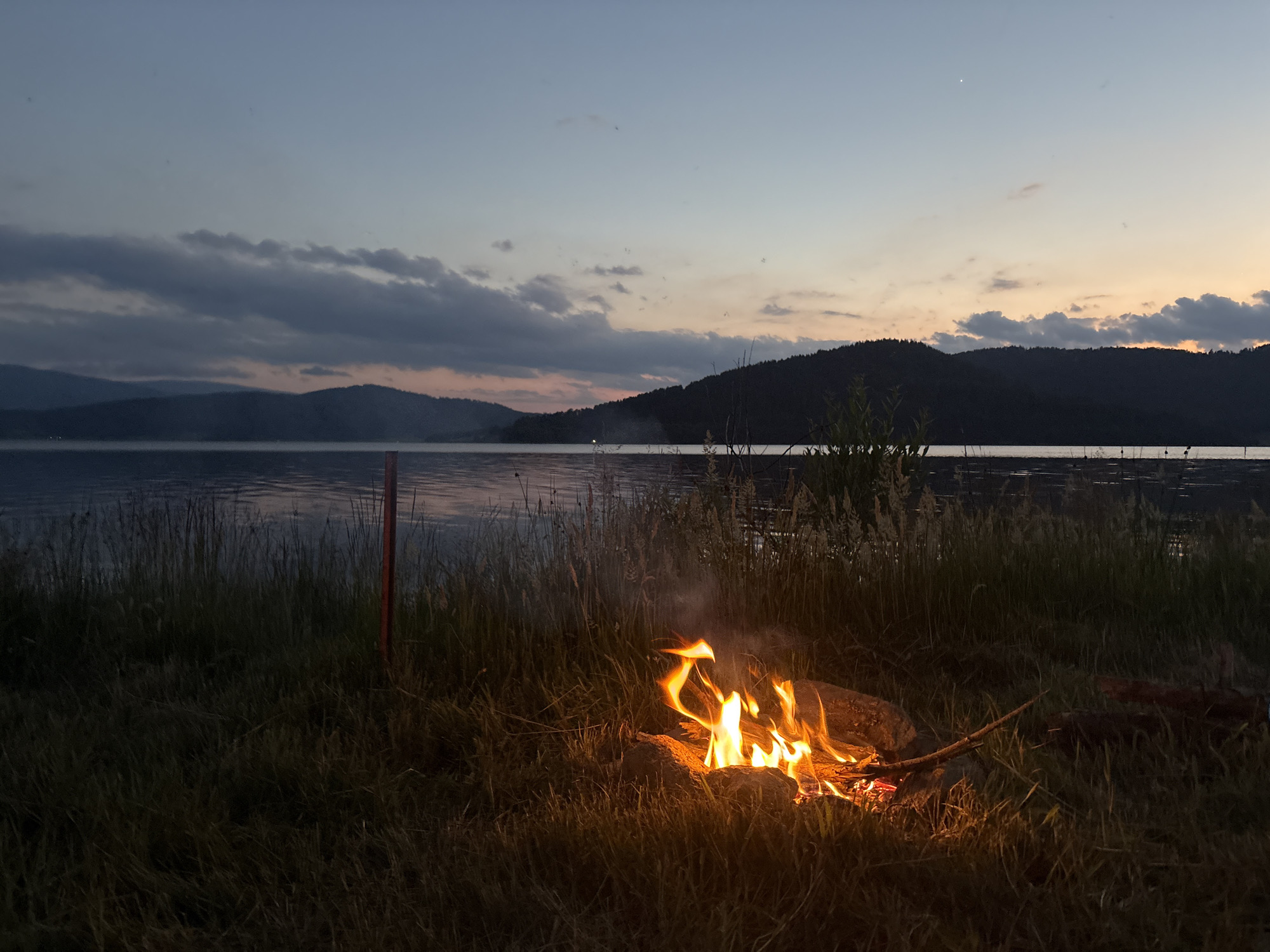 Campfire evening by the water at Batak Reservoir