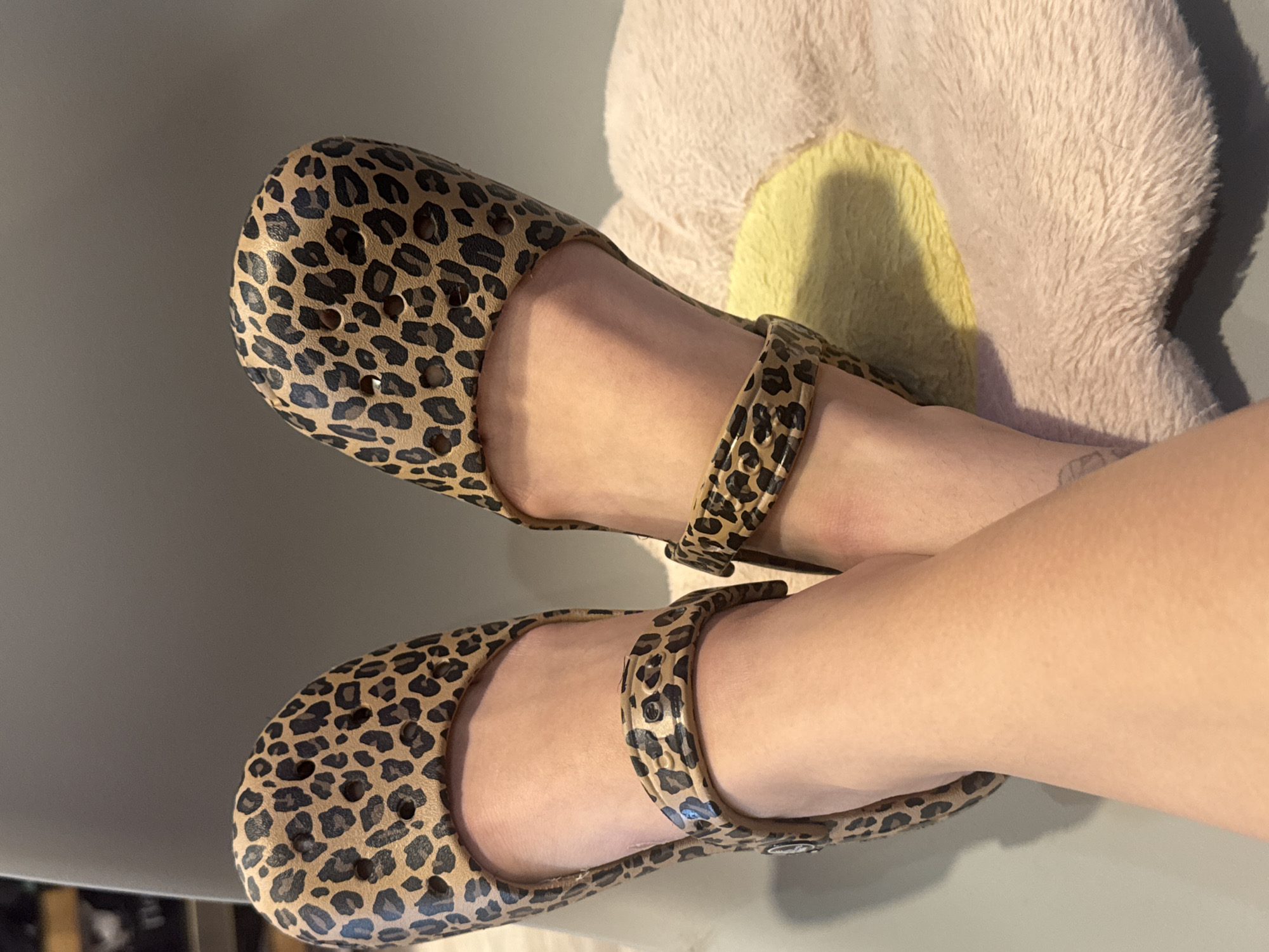 Person reading book in leopard print shoes, Podolsk
