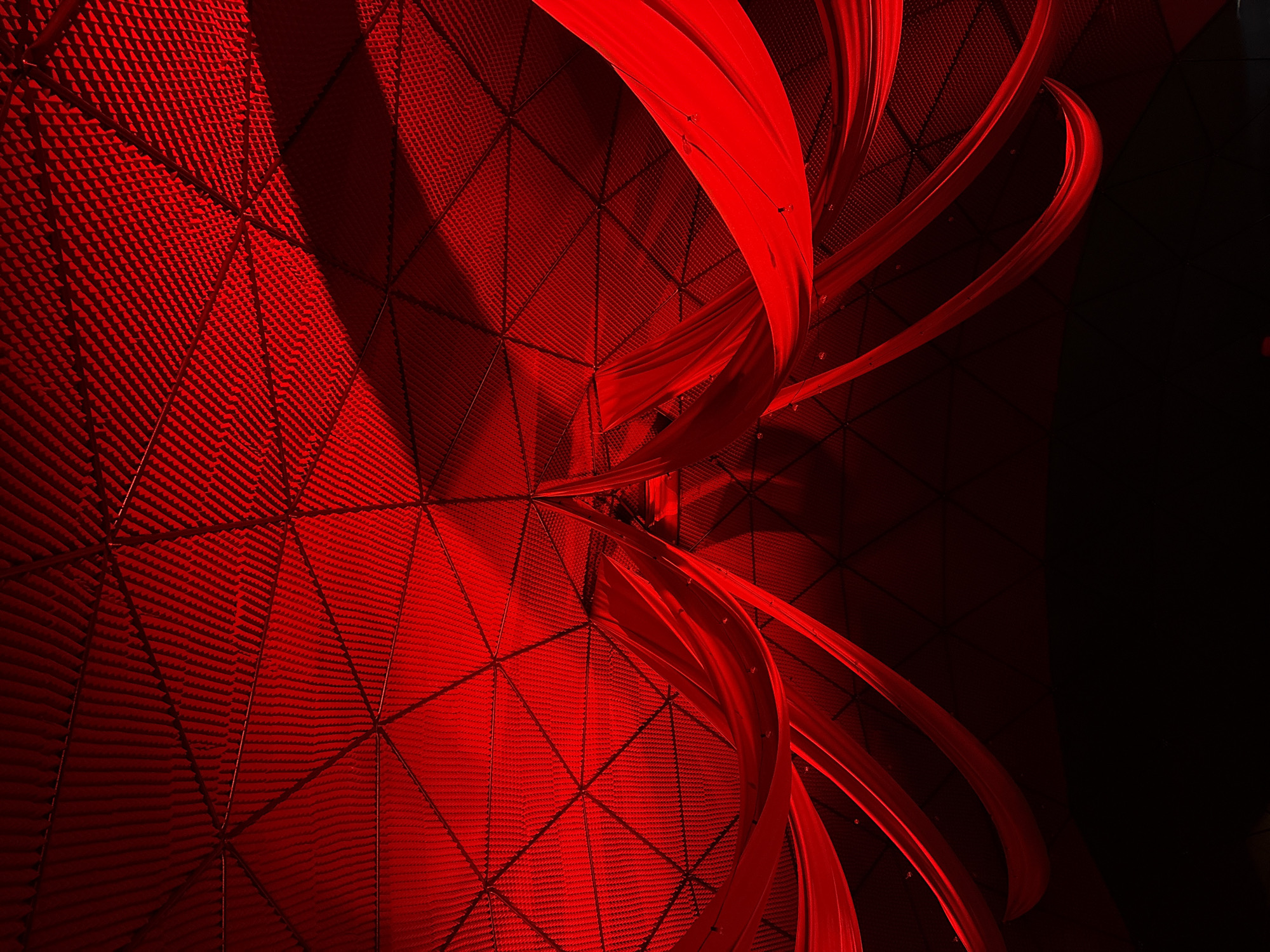 Red-lit dome venue in Žemaitkiemis hosts an evening gathering