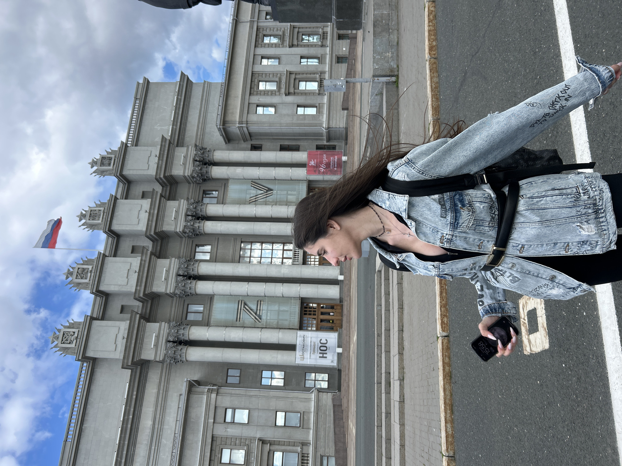 Outside a classical building with a statue, Novokuybyshevsk