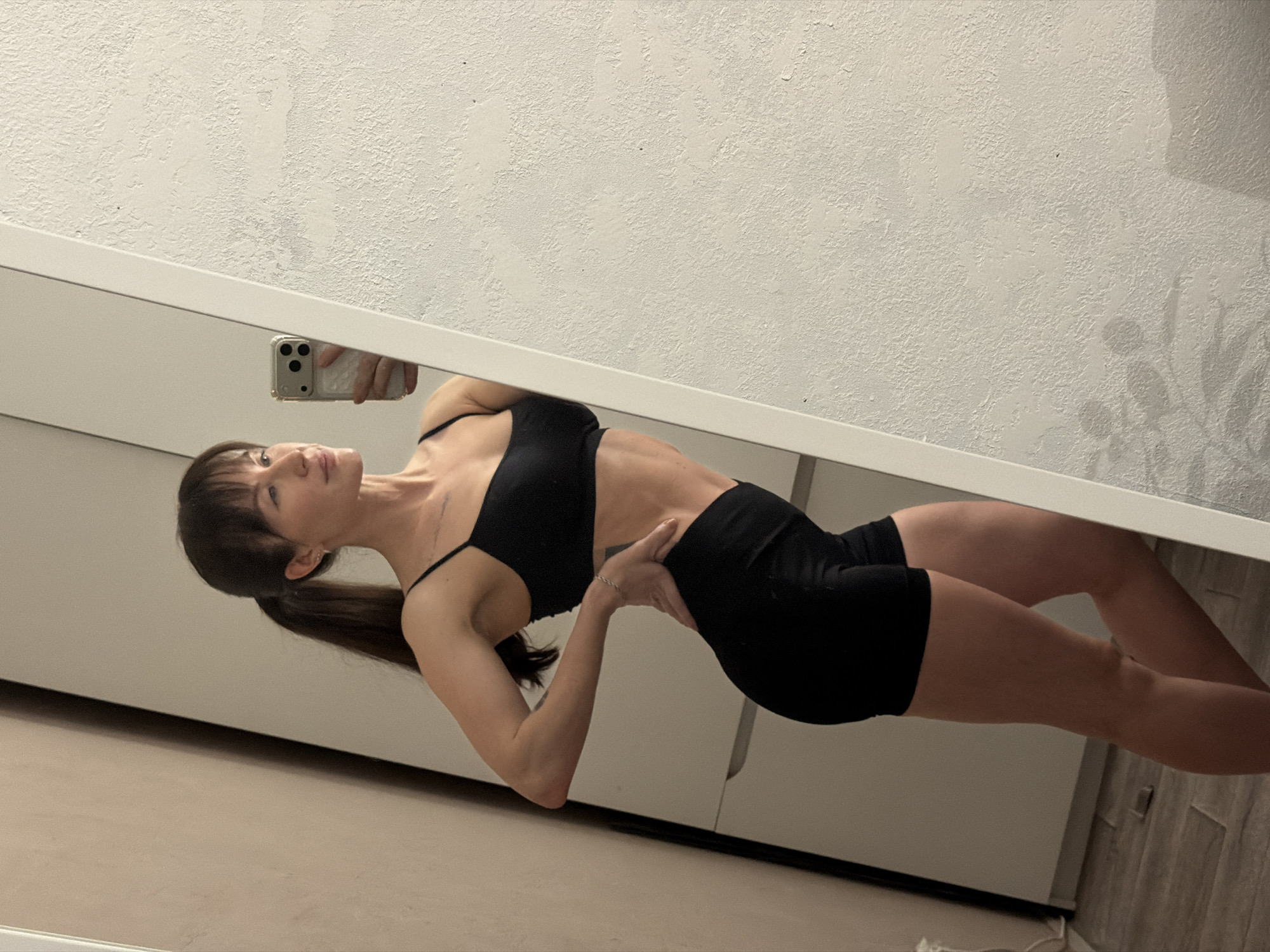 Woman takes workout selfies in Perm apartment