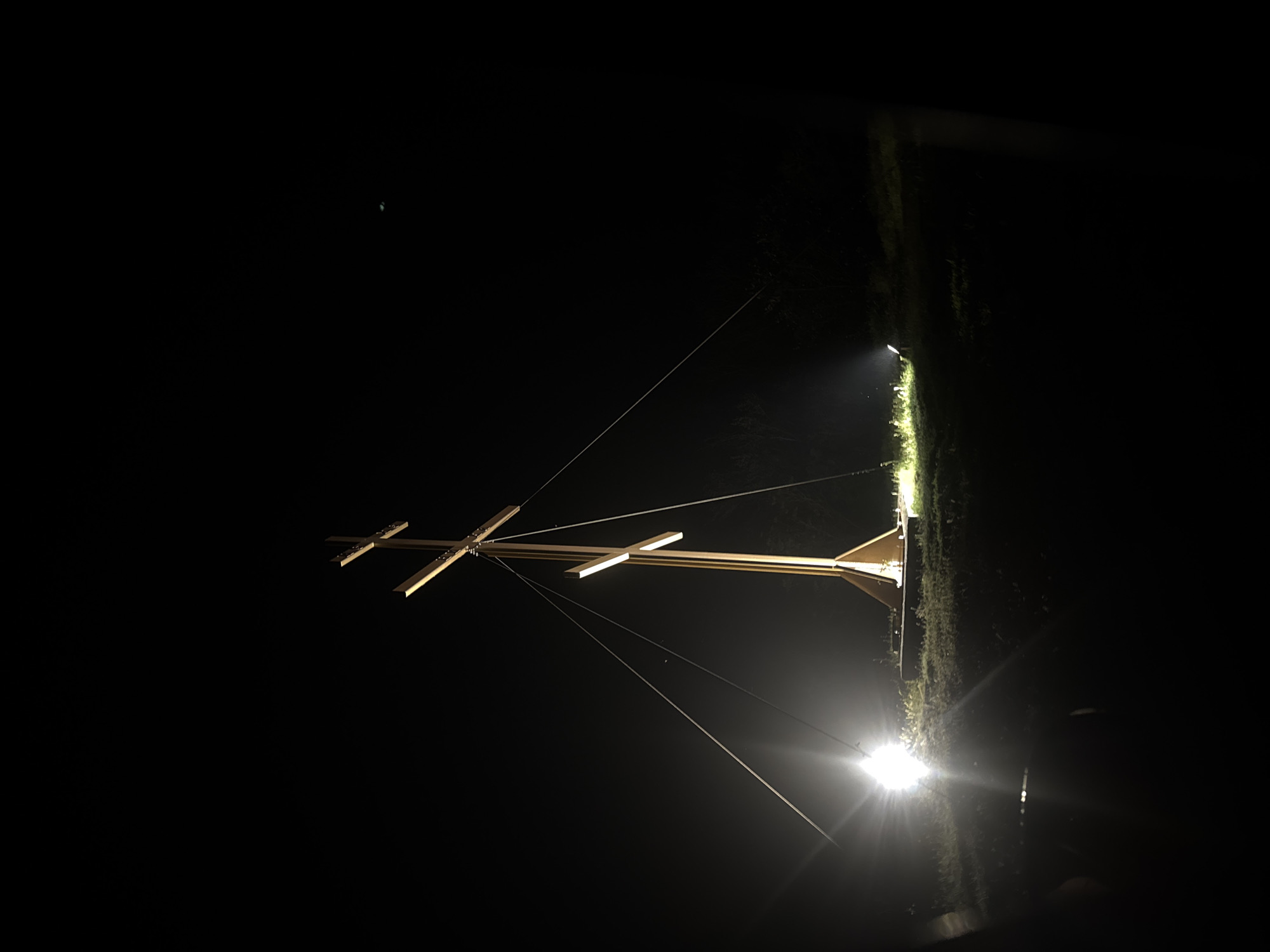Illuminated wooden structure suspended by wires observed in Konstantinovo