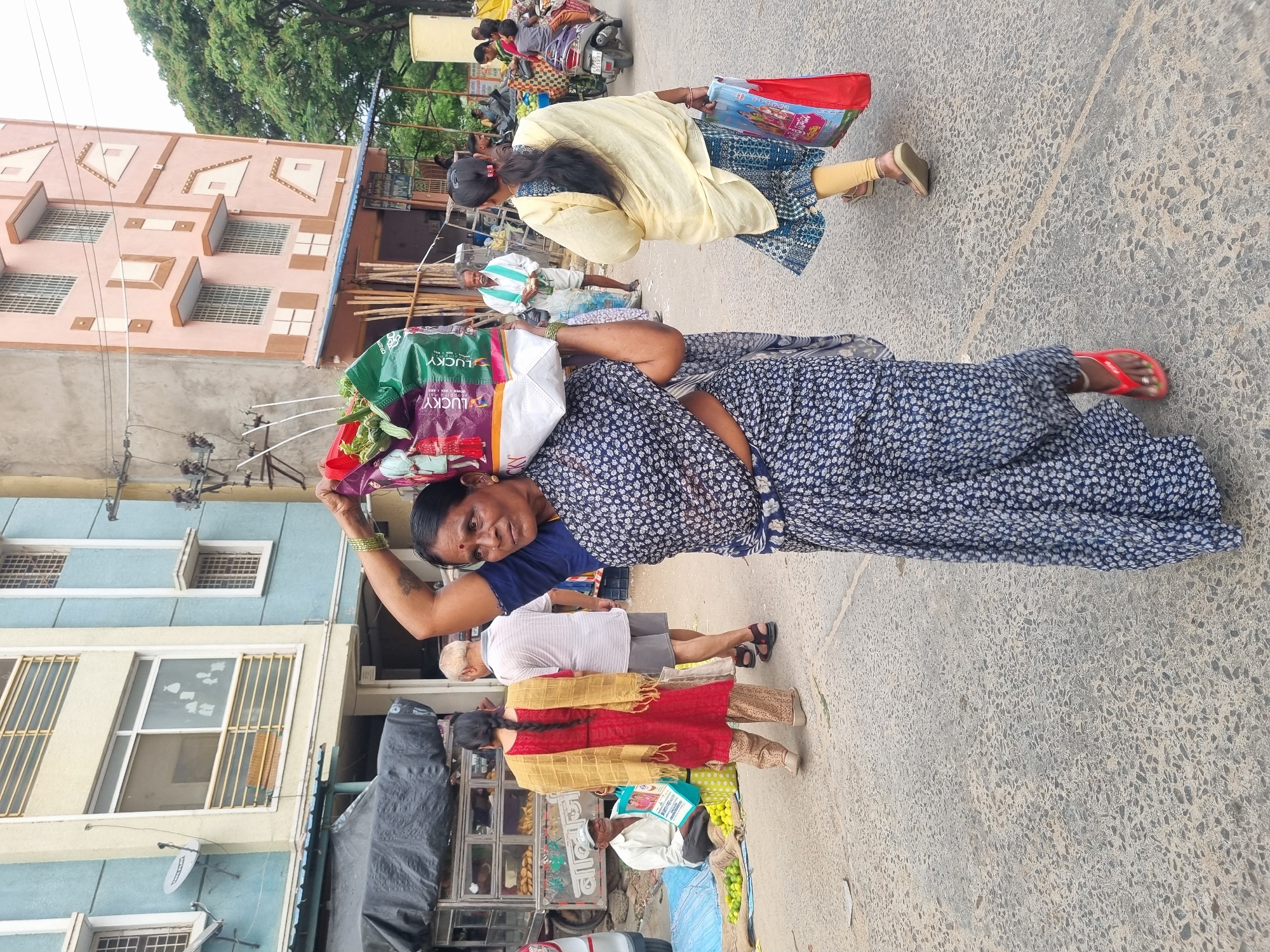 Street vendors operate morning vegetable market in Puttaparthi, India