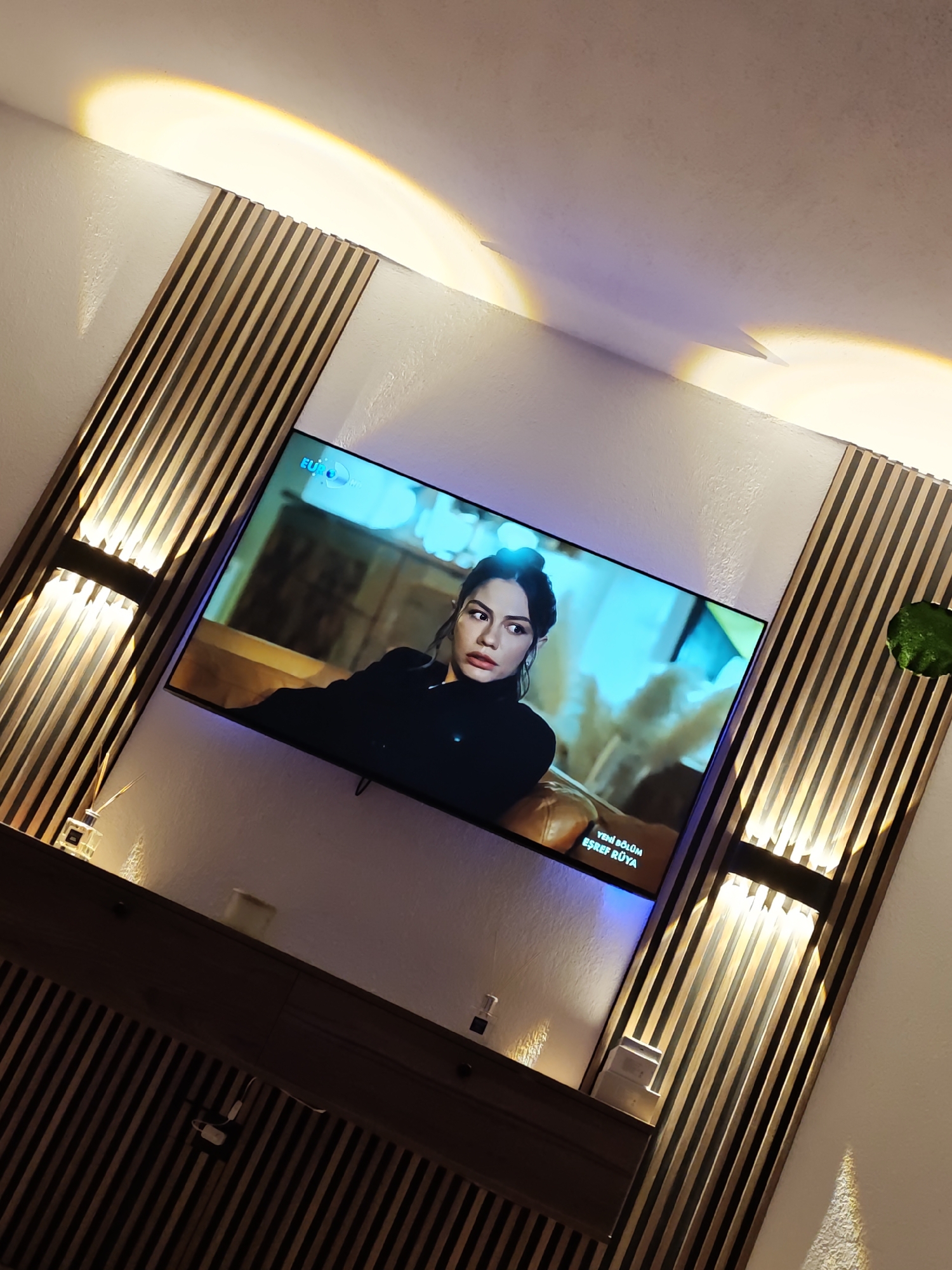 Television displays woman's image between decorative panels in Bulgaria