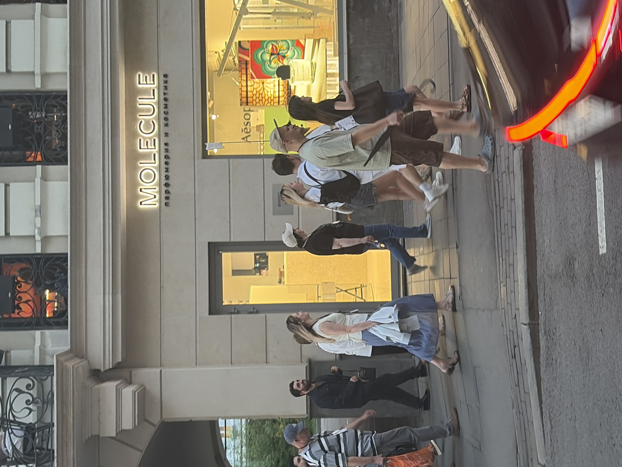Urban street life documented across commercial district during evening hours