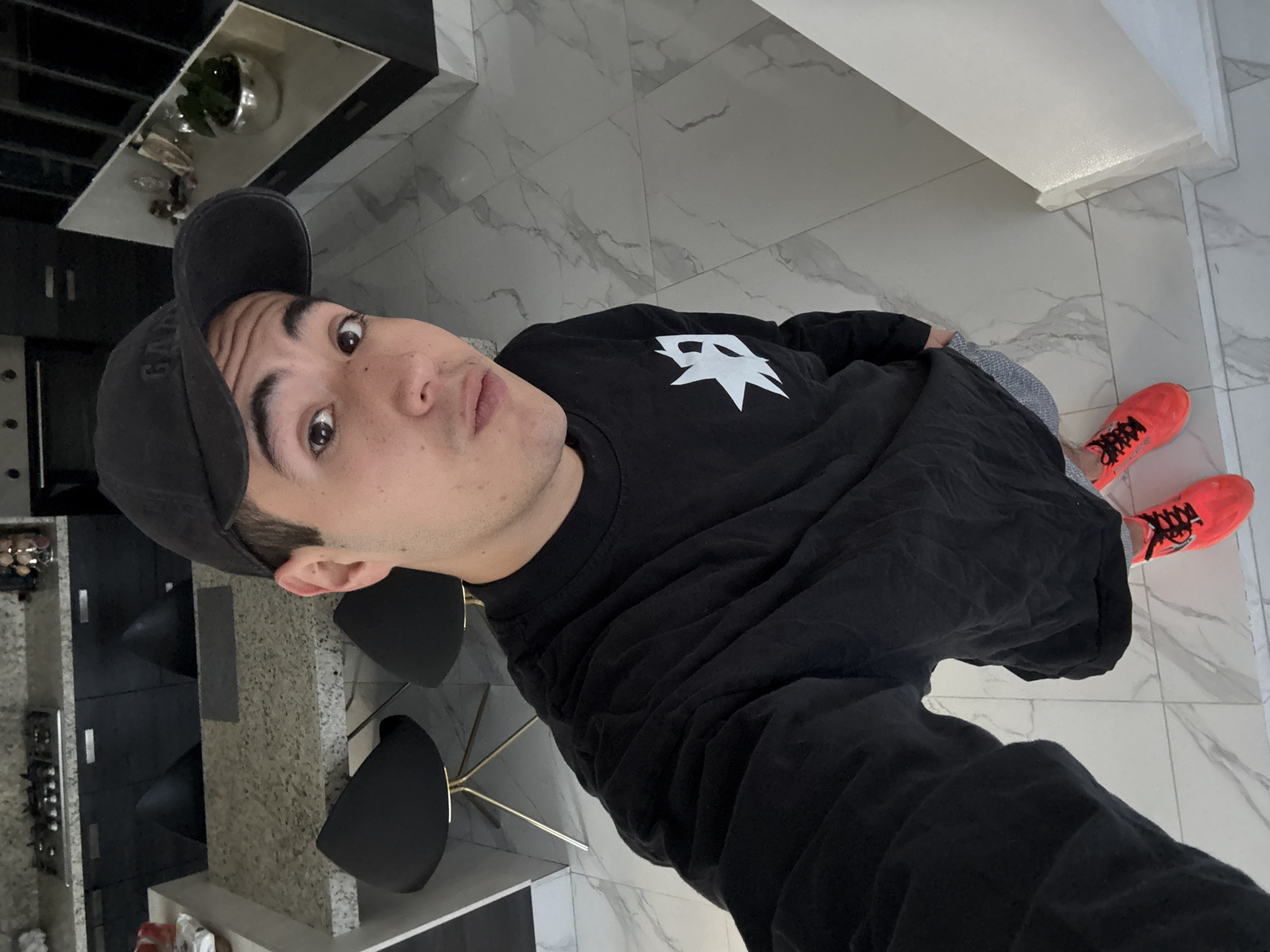 Young man takes selfies at home in Mexico