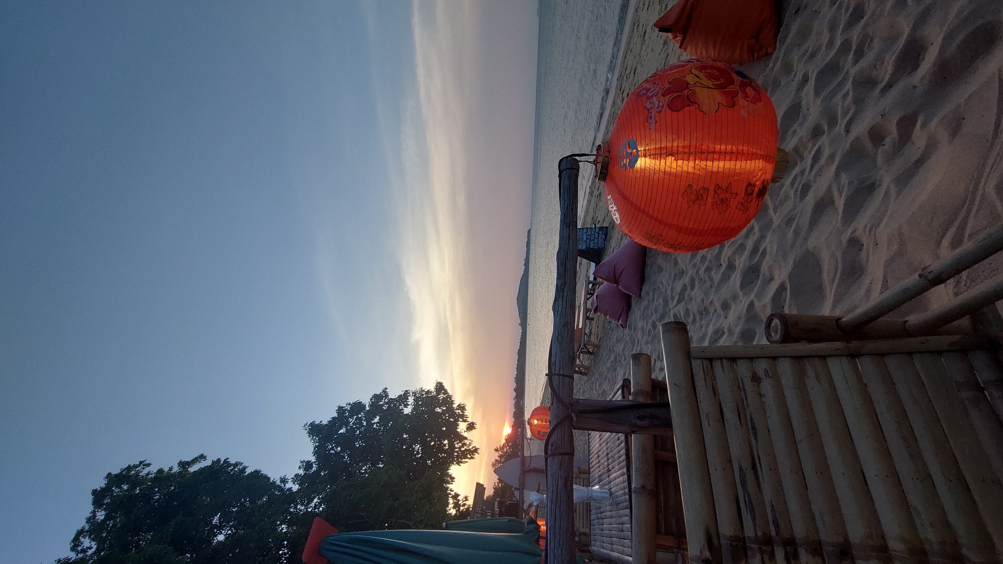 Orange Chinese lantern displayed at Thailand beach sunset