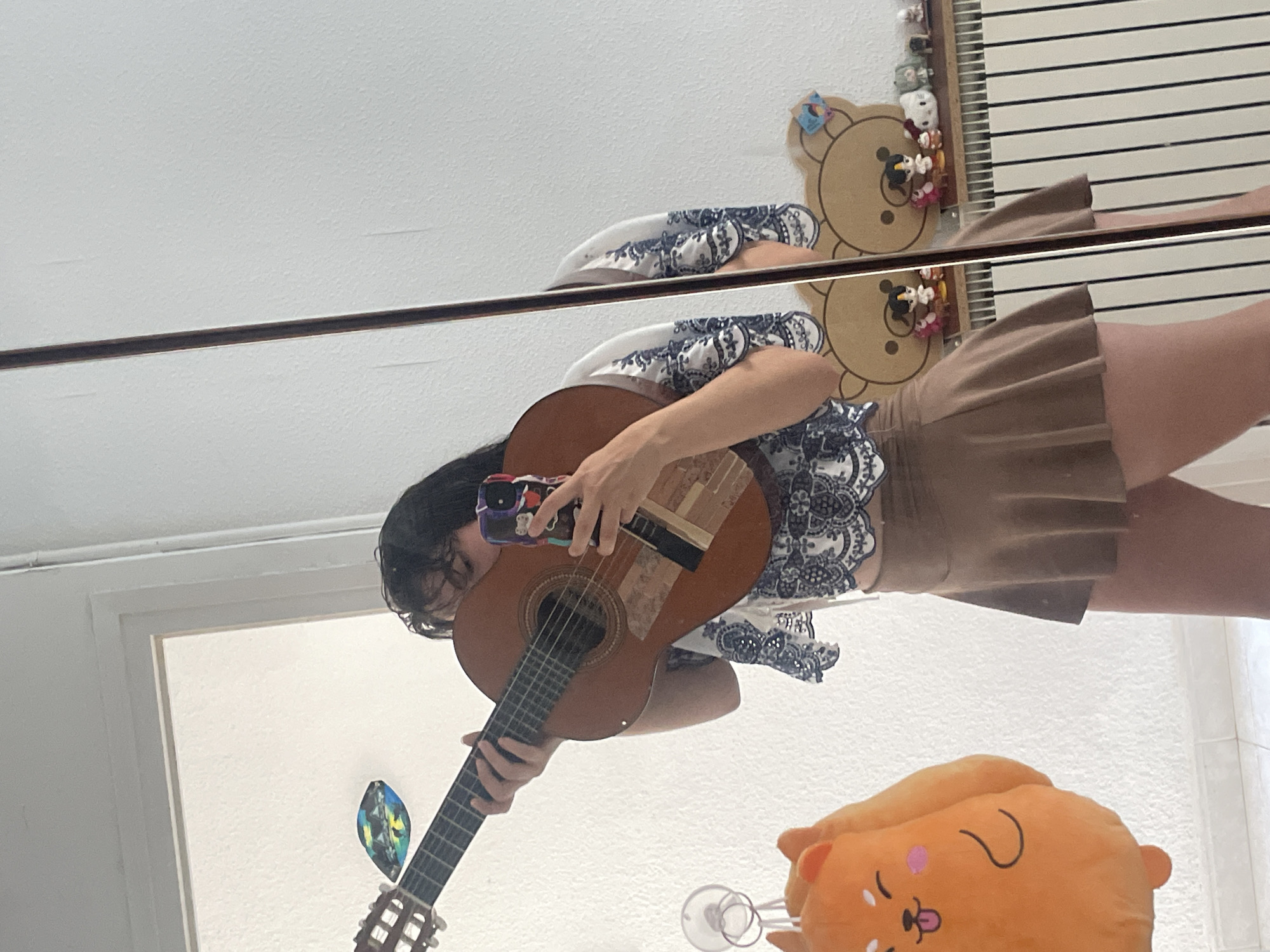 Mirror selfie with acoustic guitar in Canet de Mar