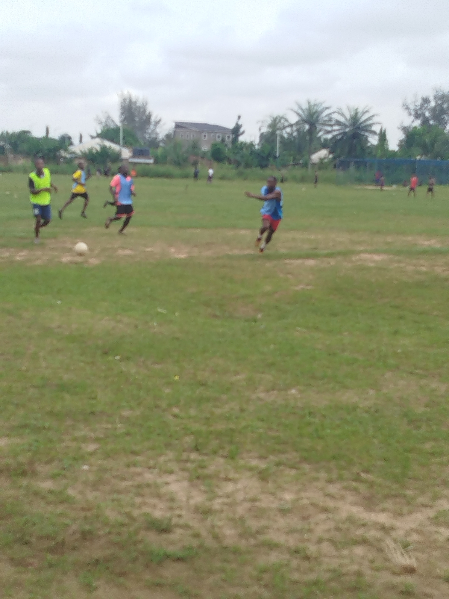 Soccer game observed on field in Ikot Mbonde, Nigeria