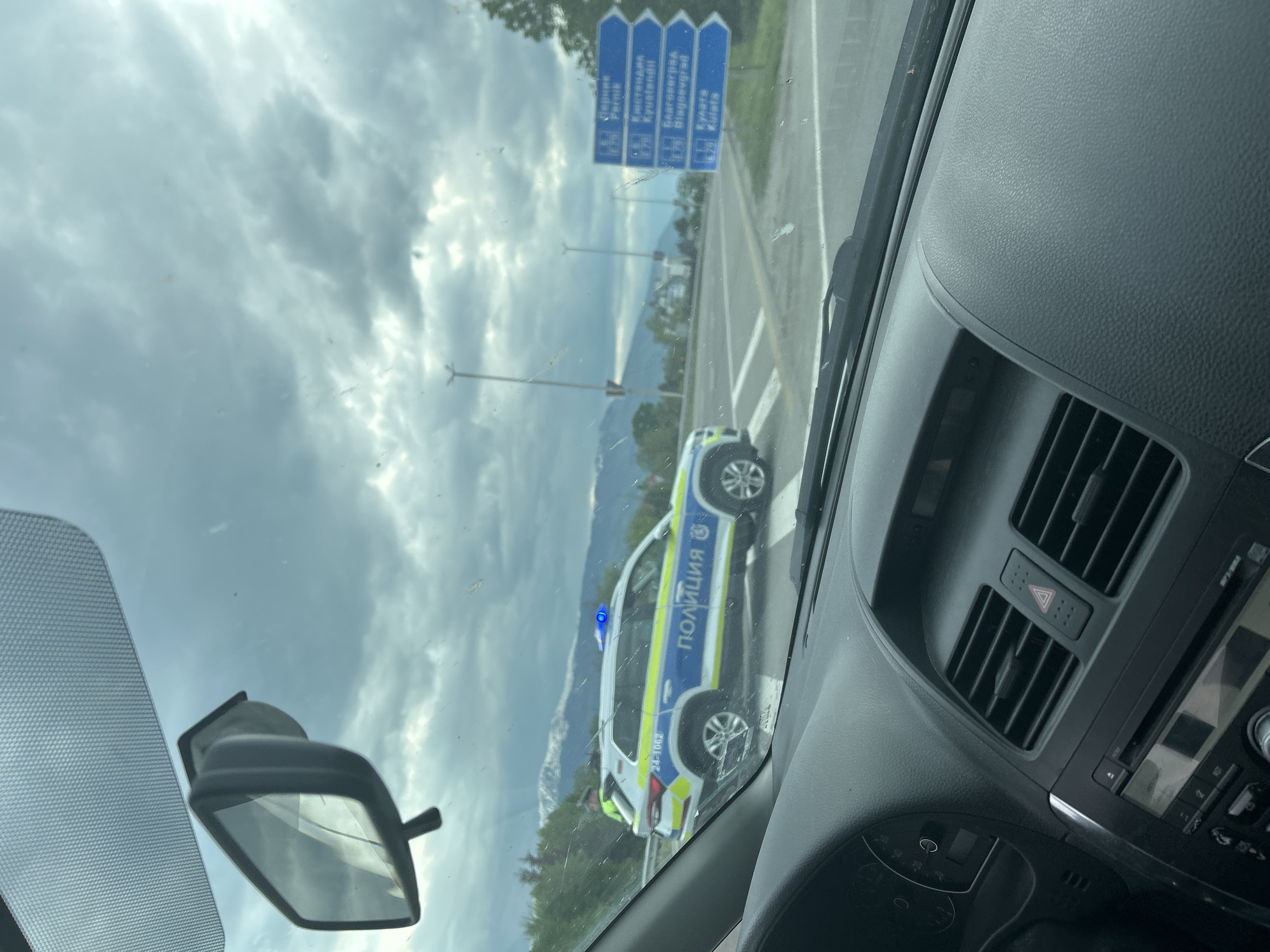 Police vehicle spotted with blue light activated near Lozen