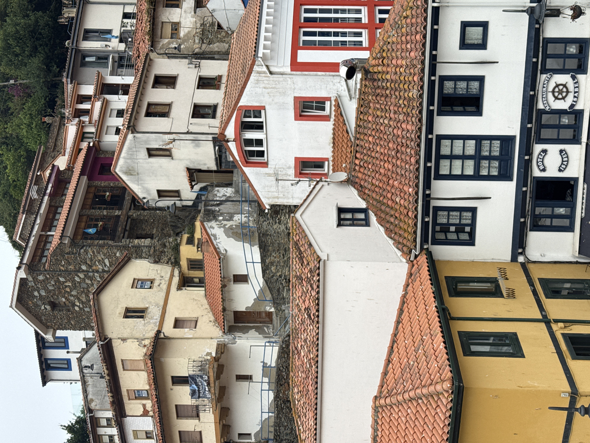 Inside Cudillero's stacked streets, colorful facades, and harbor waterfront