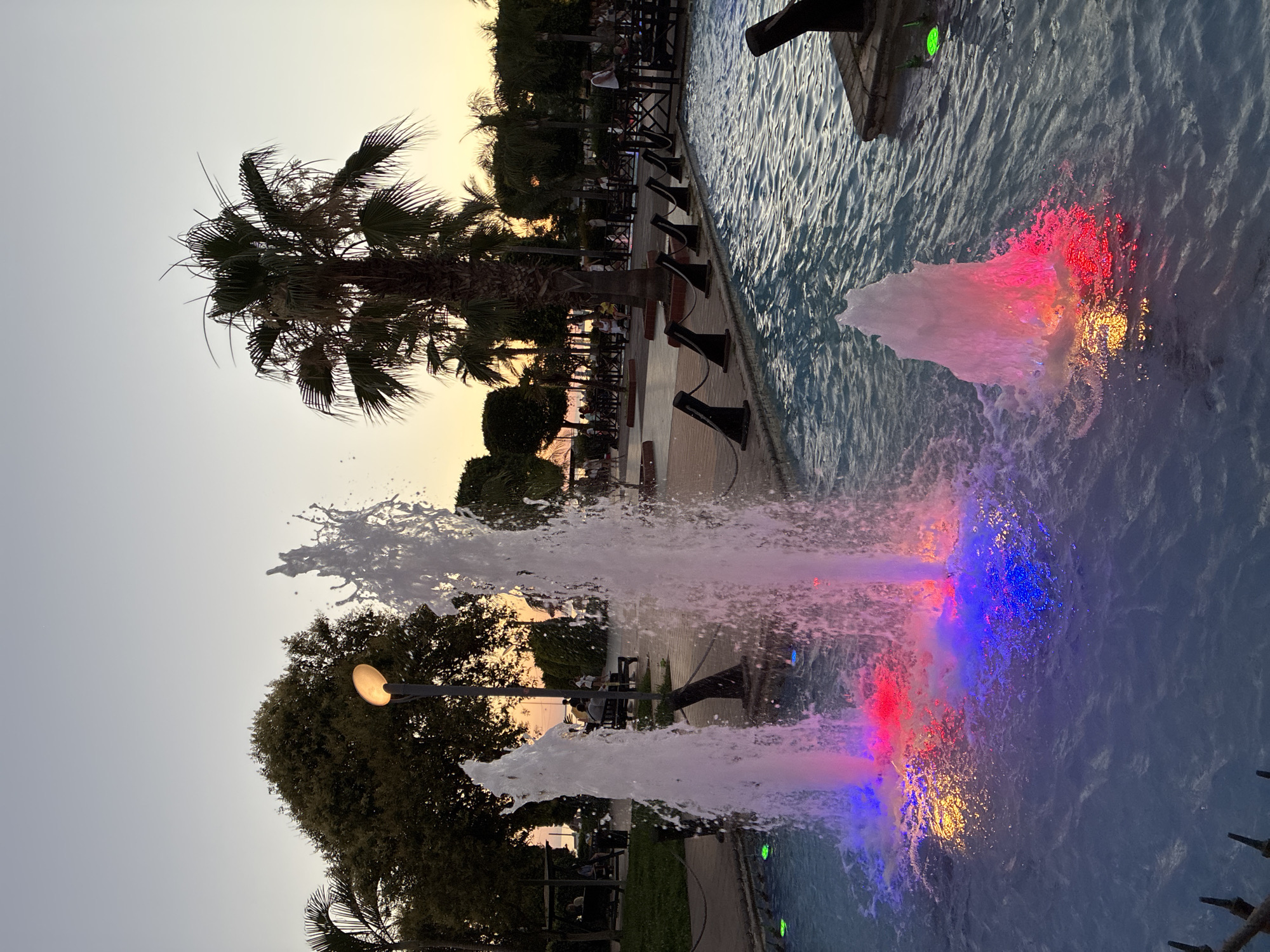 Alanya beachfront at golden hour: cats, fountains, and calm seas