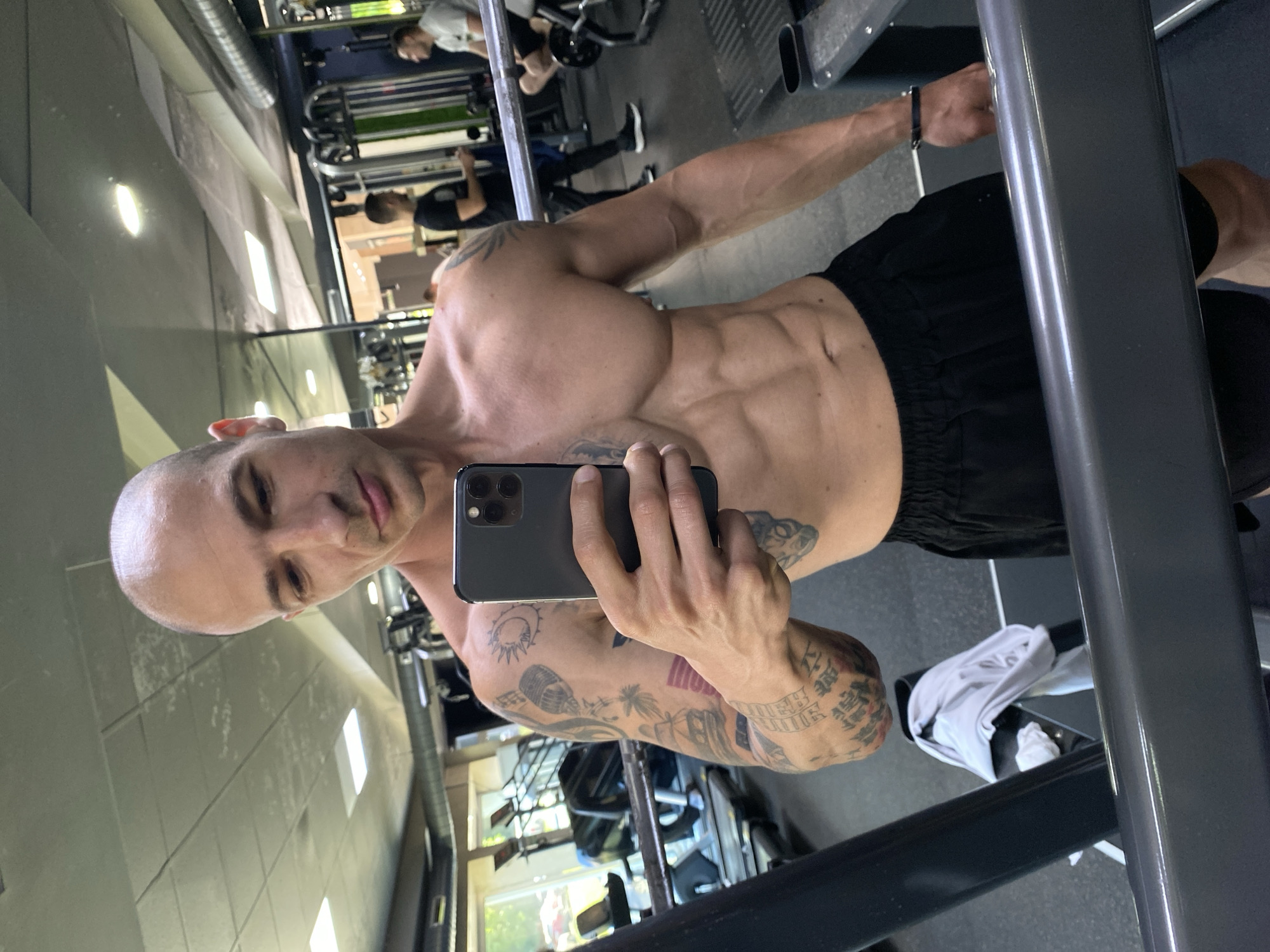 Tattooed man documents early morning workout session in Bulgarian gym