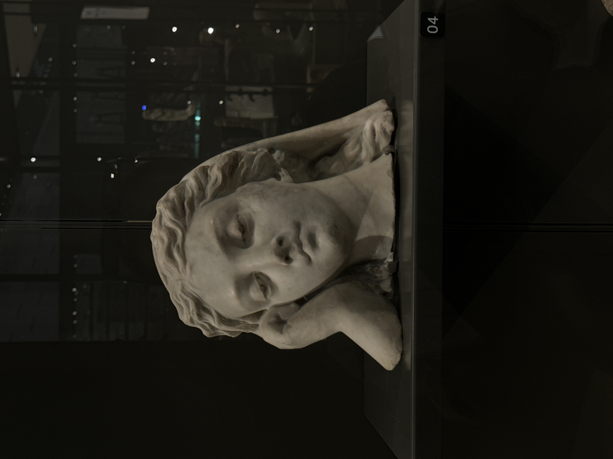 White marble sculpture observed in reclining pose, Egypt