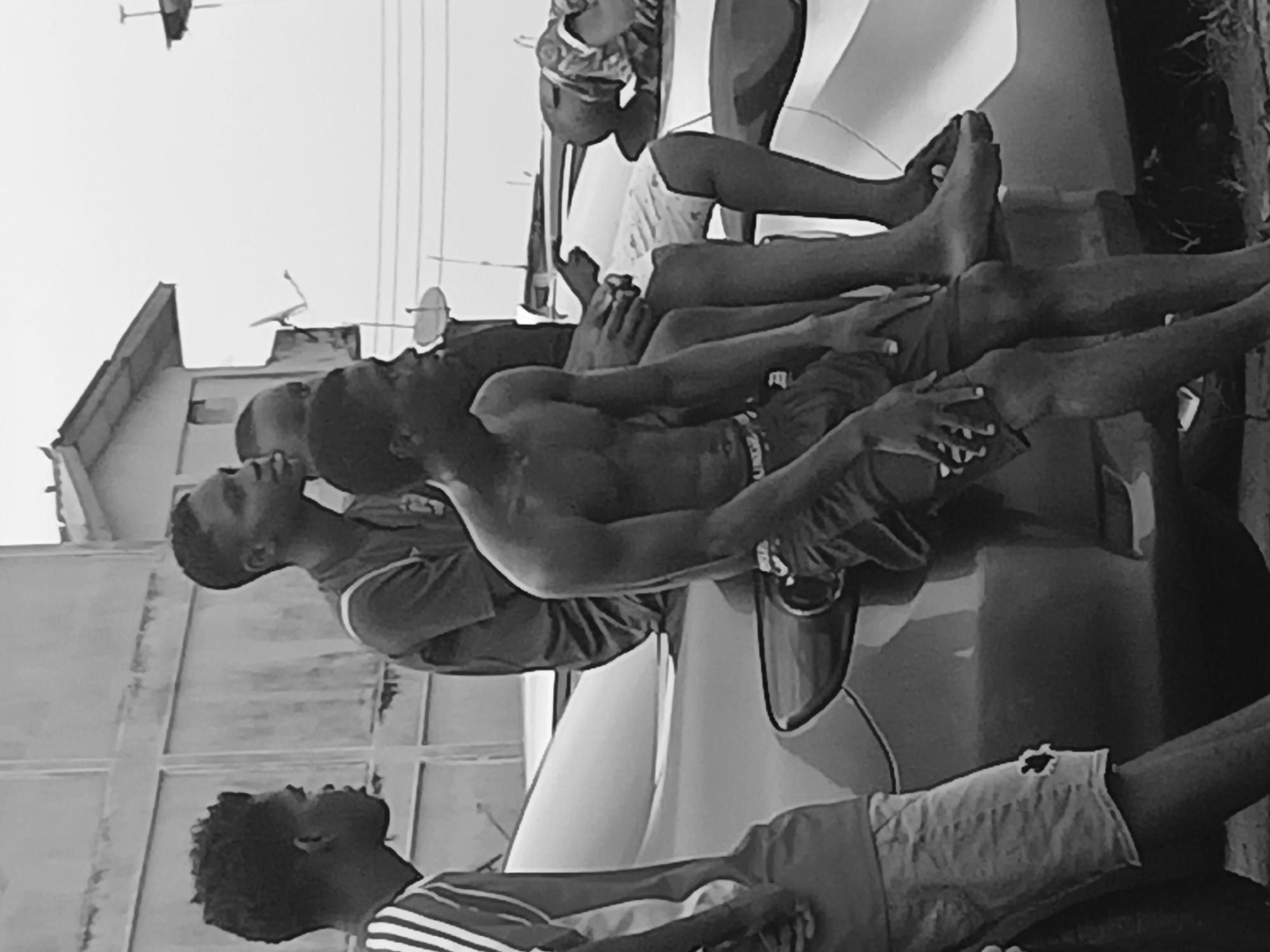 Young men play street soccer in Lagos residential area
