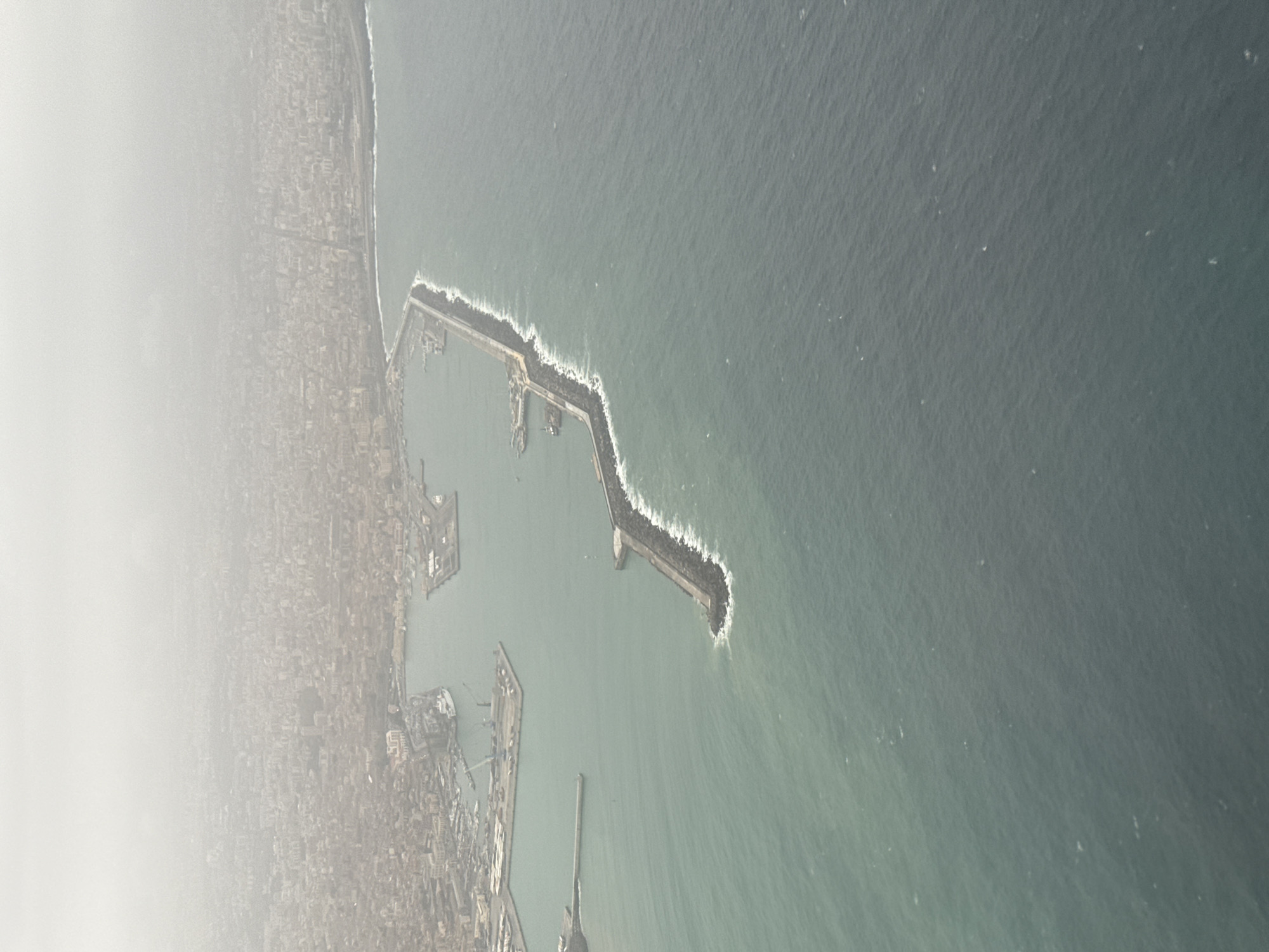 Aerial view captures Catania port breakwater at dawn