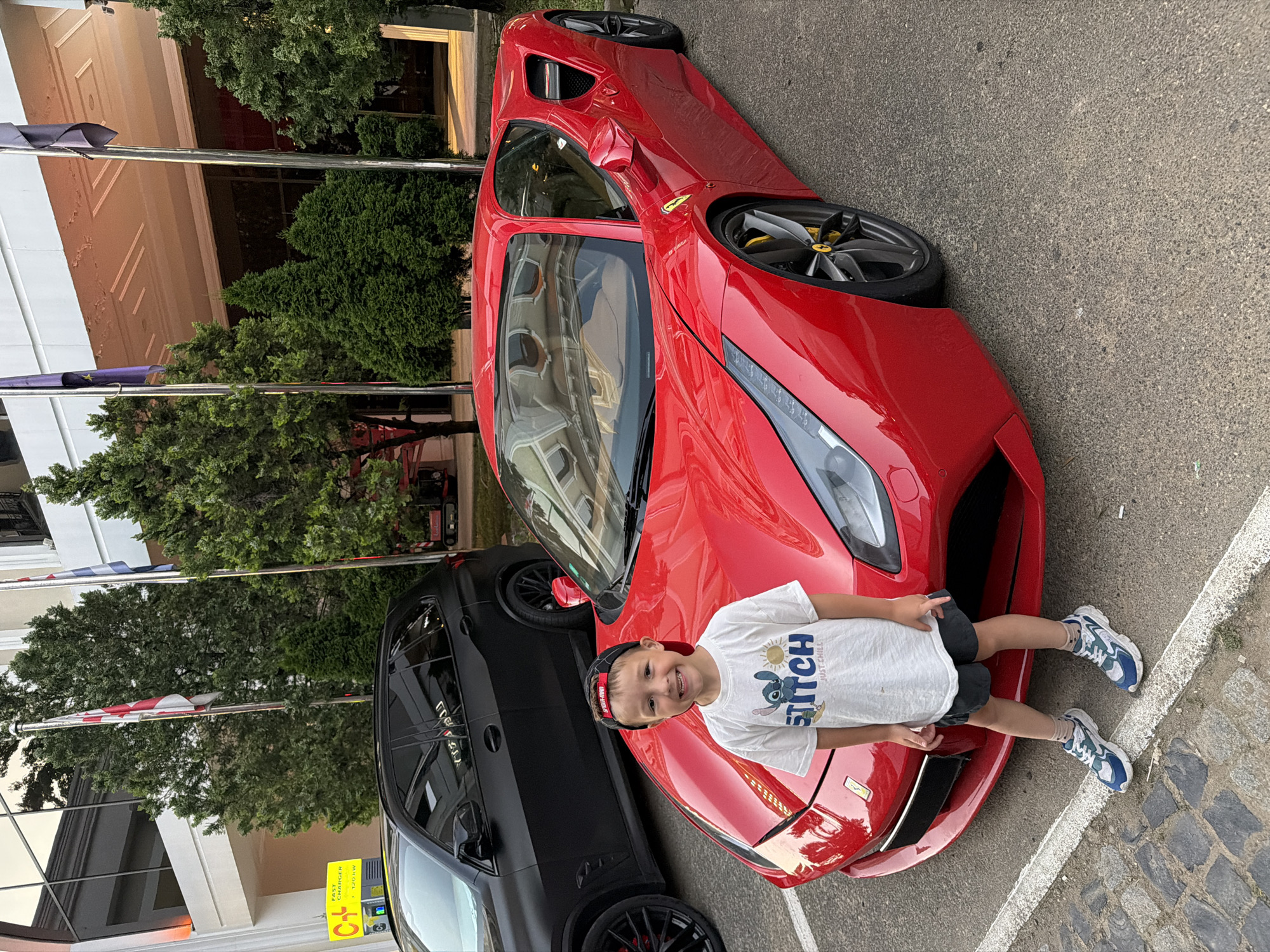 Posing next to a red Ferrari in Batumi, Georgia