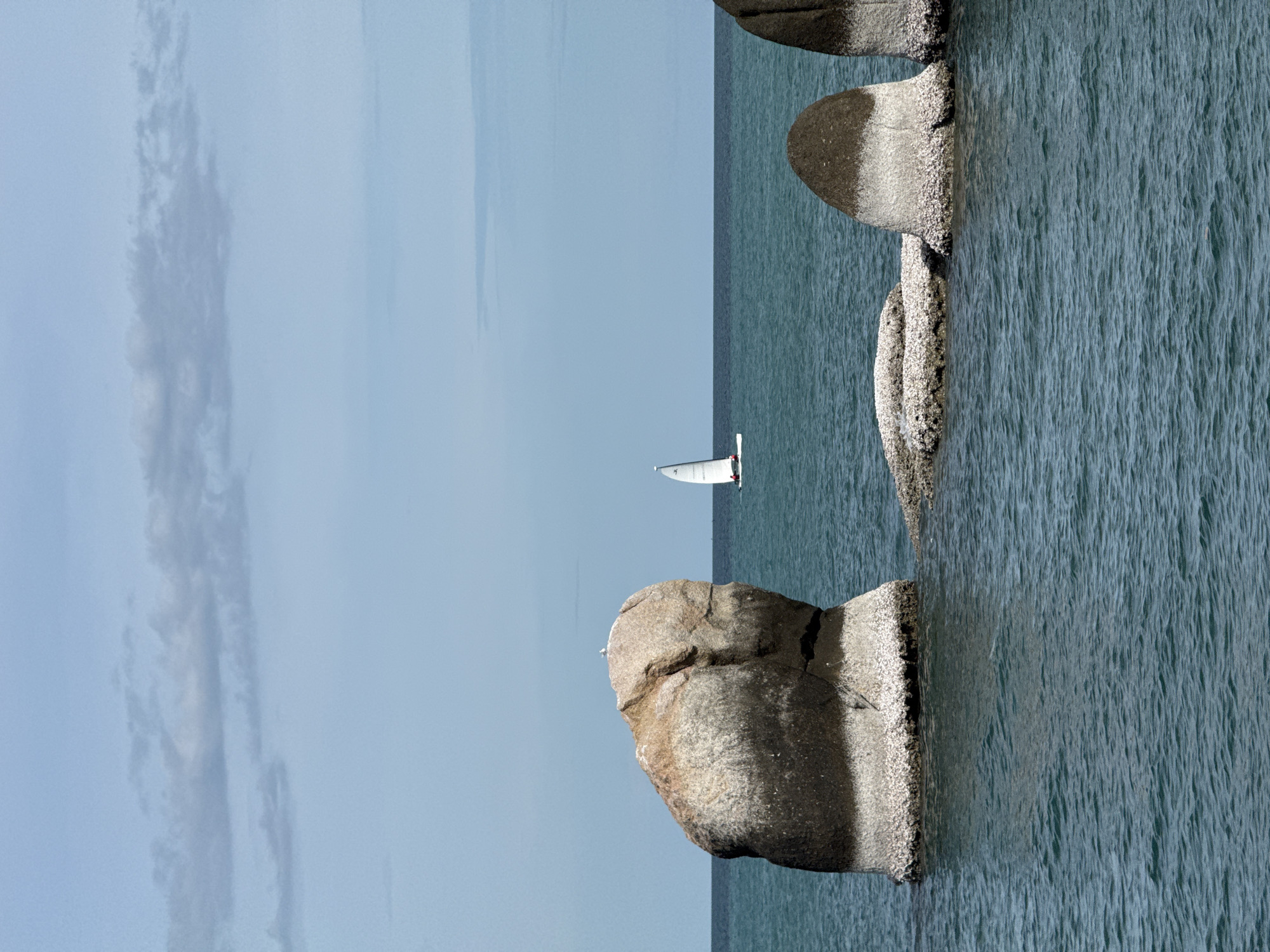 Weathered rocks and teal water along Ko Samui's coast