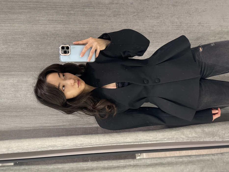 Woman takes fitting room selfies at Moscow retail store