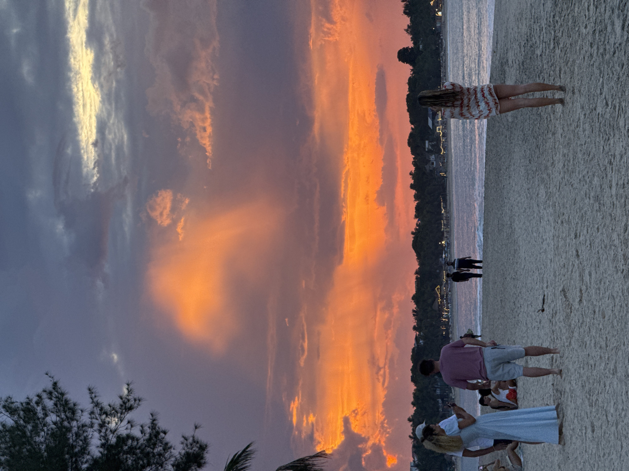 Sunset session at Arugam Bay with surfers and beachgoers