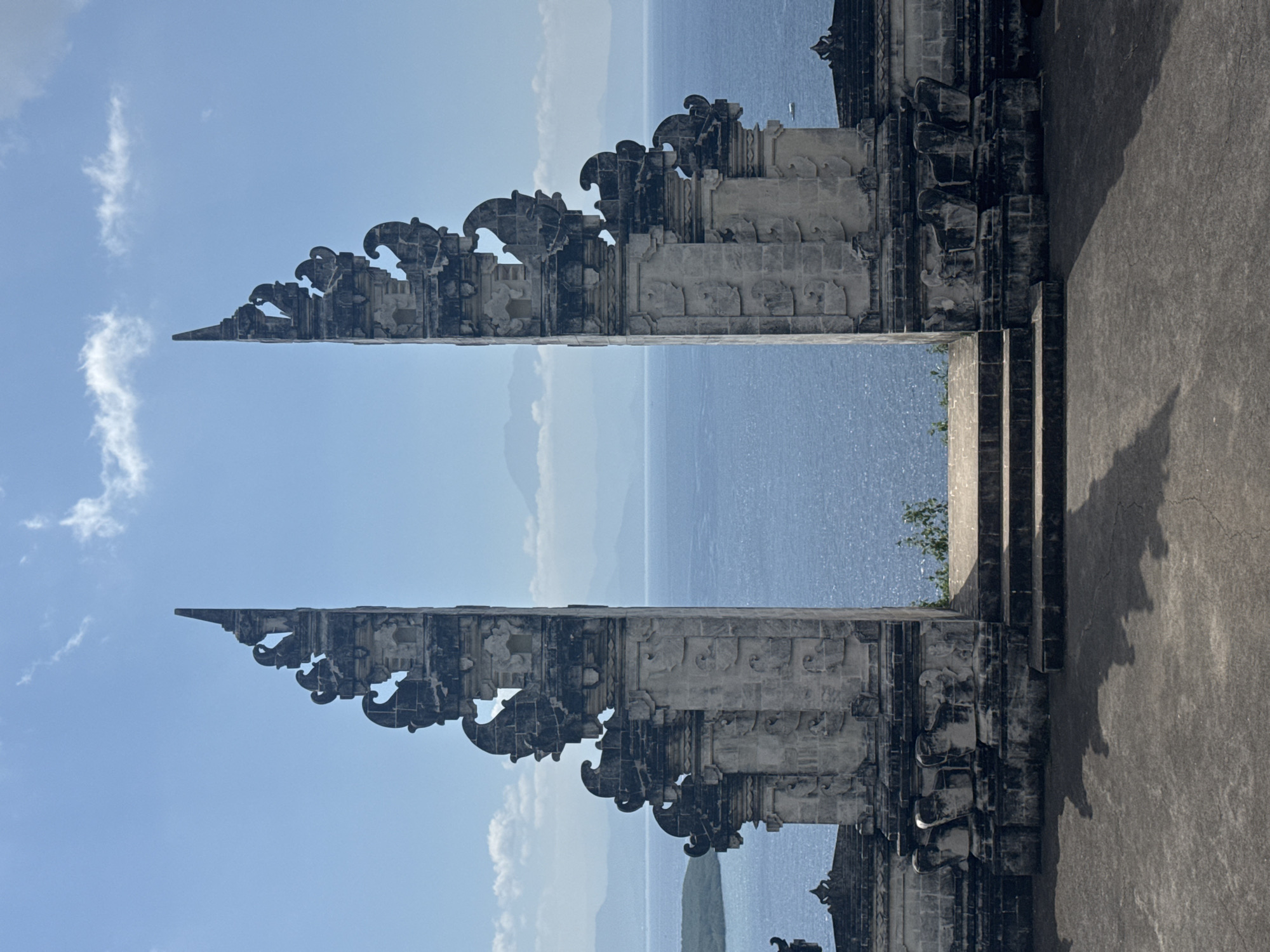 Tourist captures Balinese gates and ocean views at Nusa Penida resort