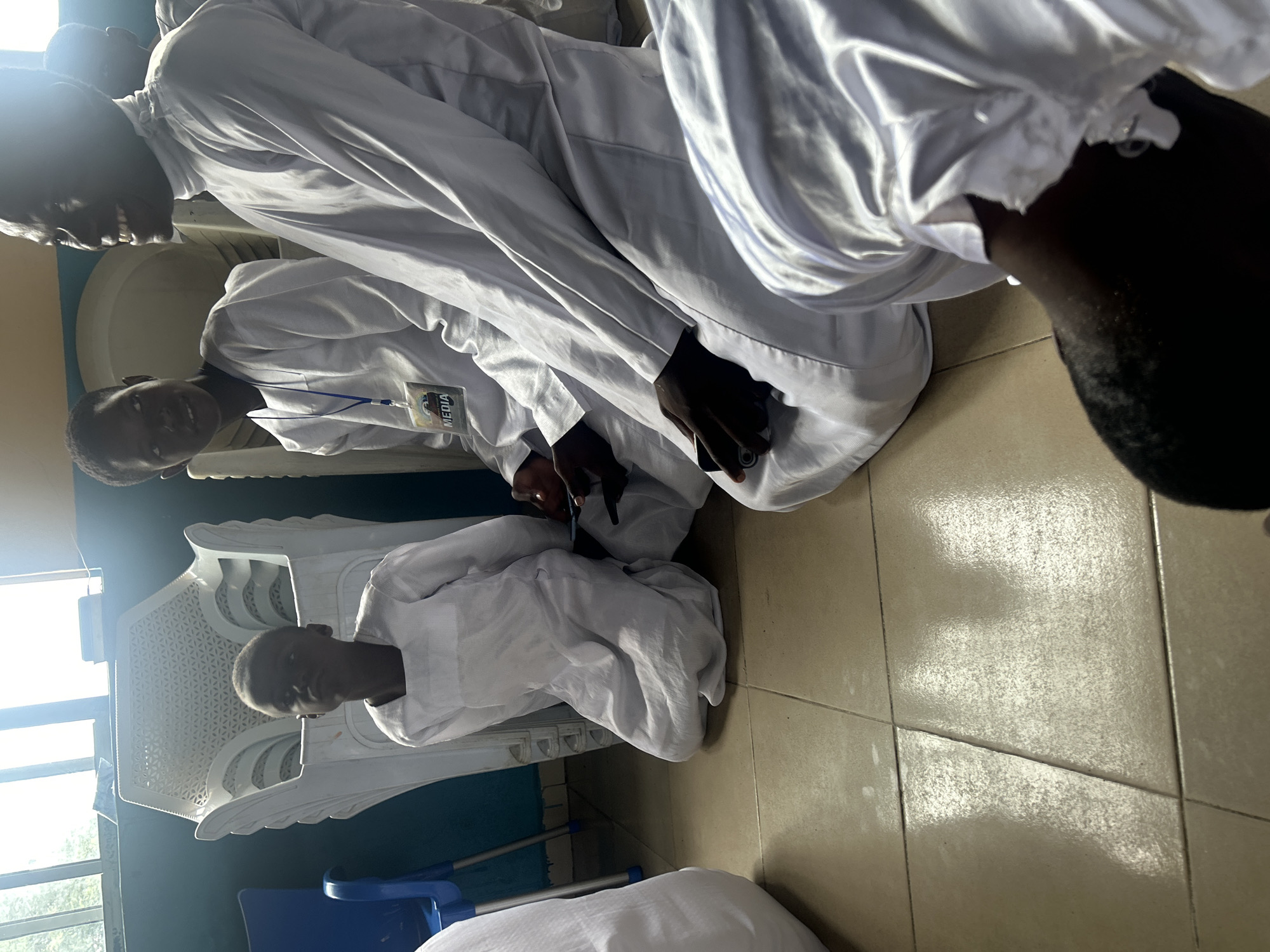 White-robed gathering documented in Adankolo indoor space