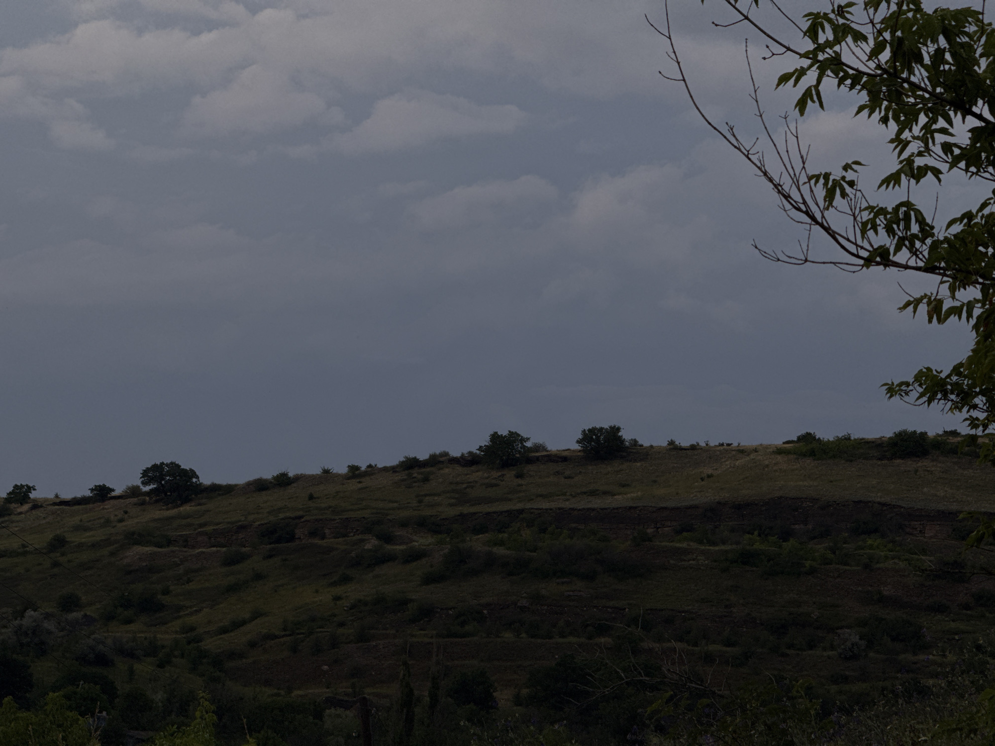 Stormy sunset over rural hills near Seleznivka, Ukraine