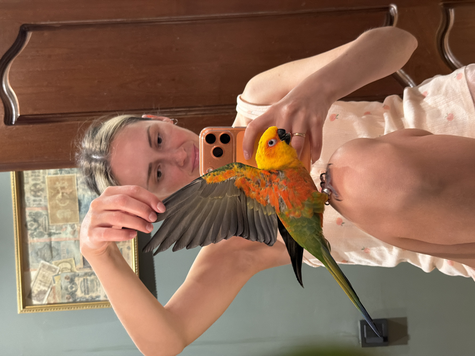 Woman takes selfies with colorful parrot in Khimki