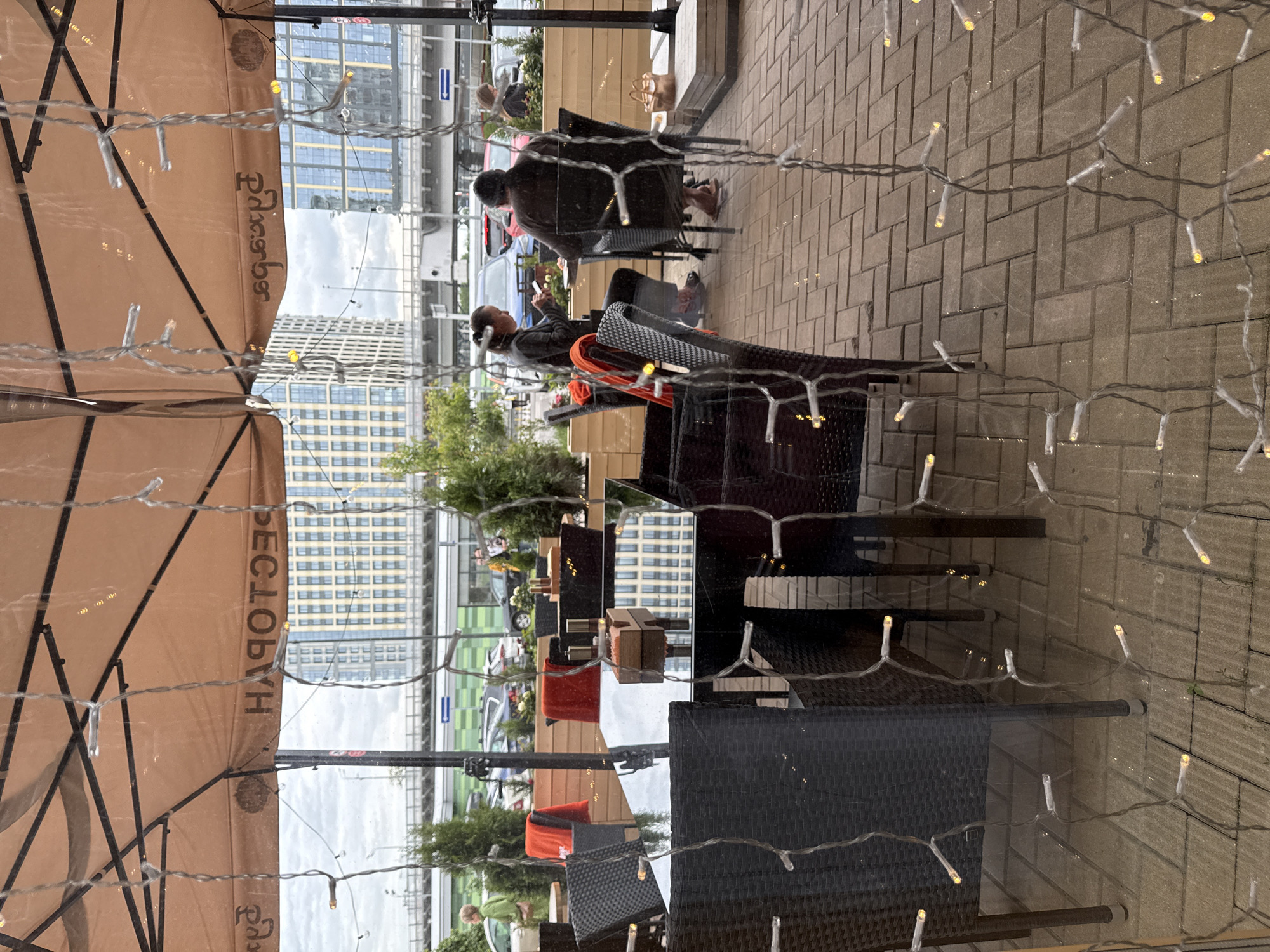 Woman enjoys afternoon cafe visit in Moscow
