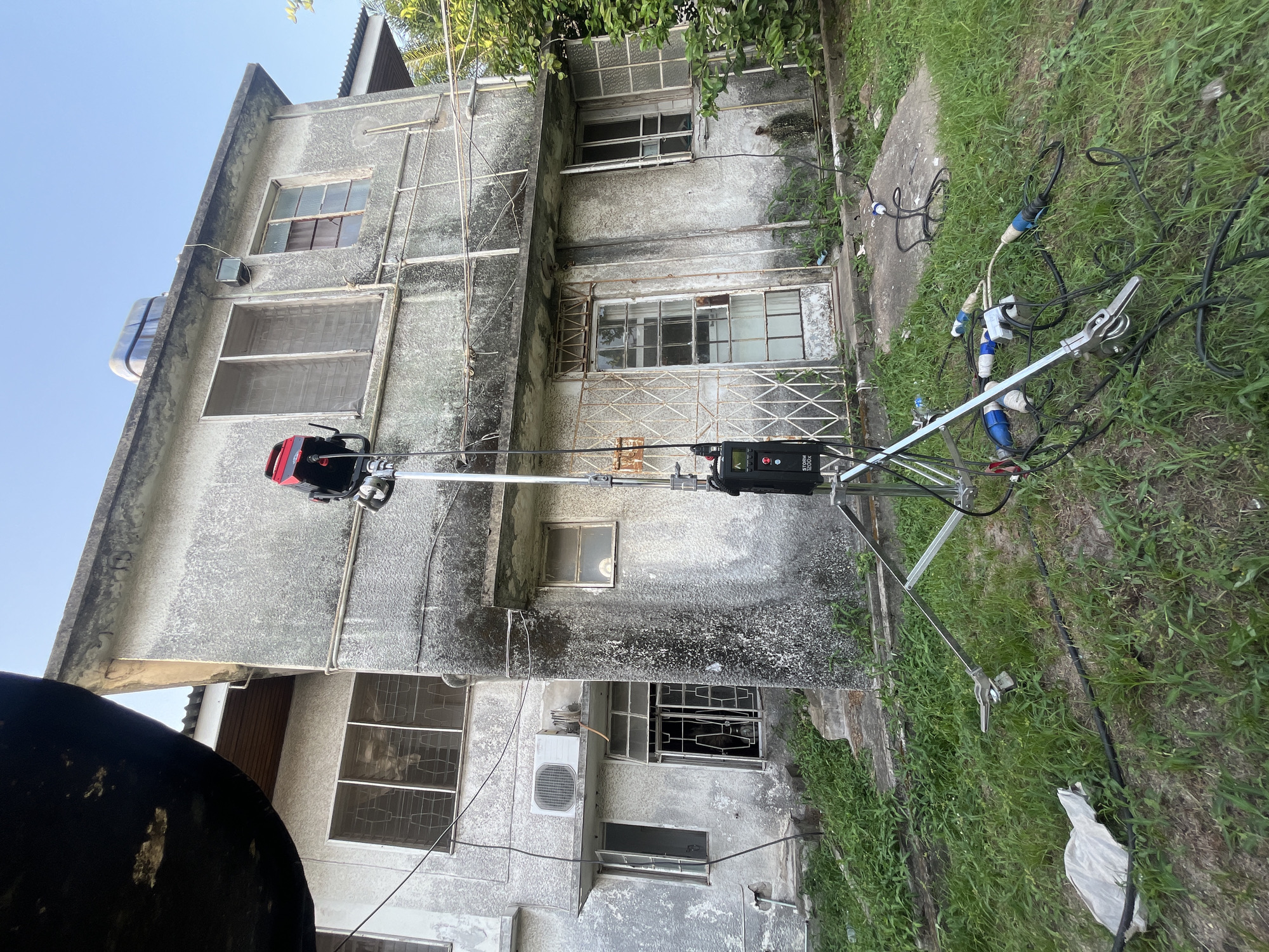 Film crew sets up professional lighting equipment in Lagos