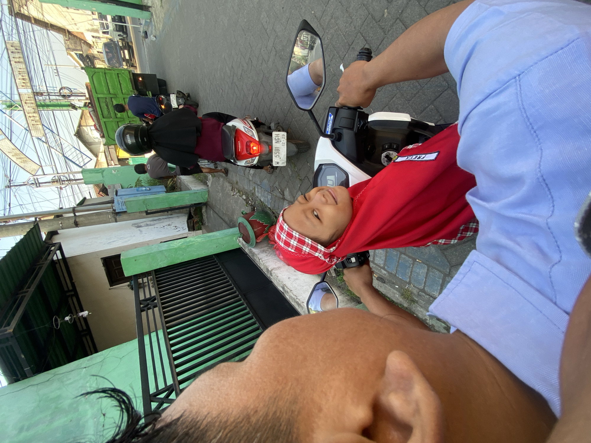Evening motorcycle rides captured across two Indonesian villages
