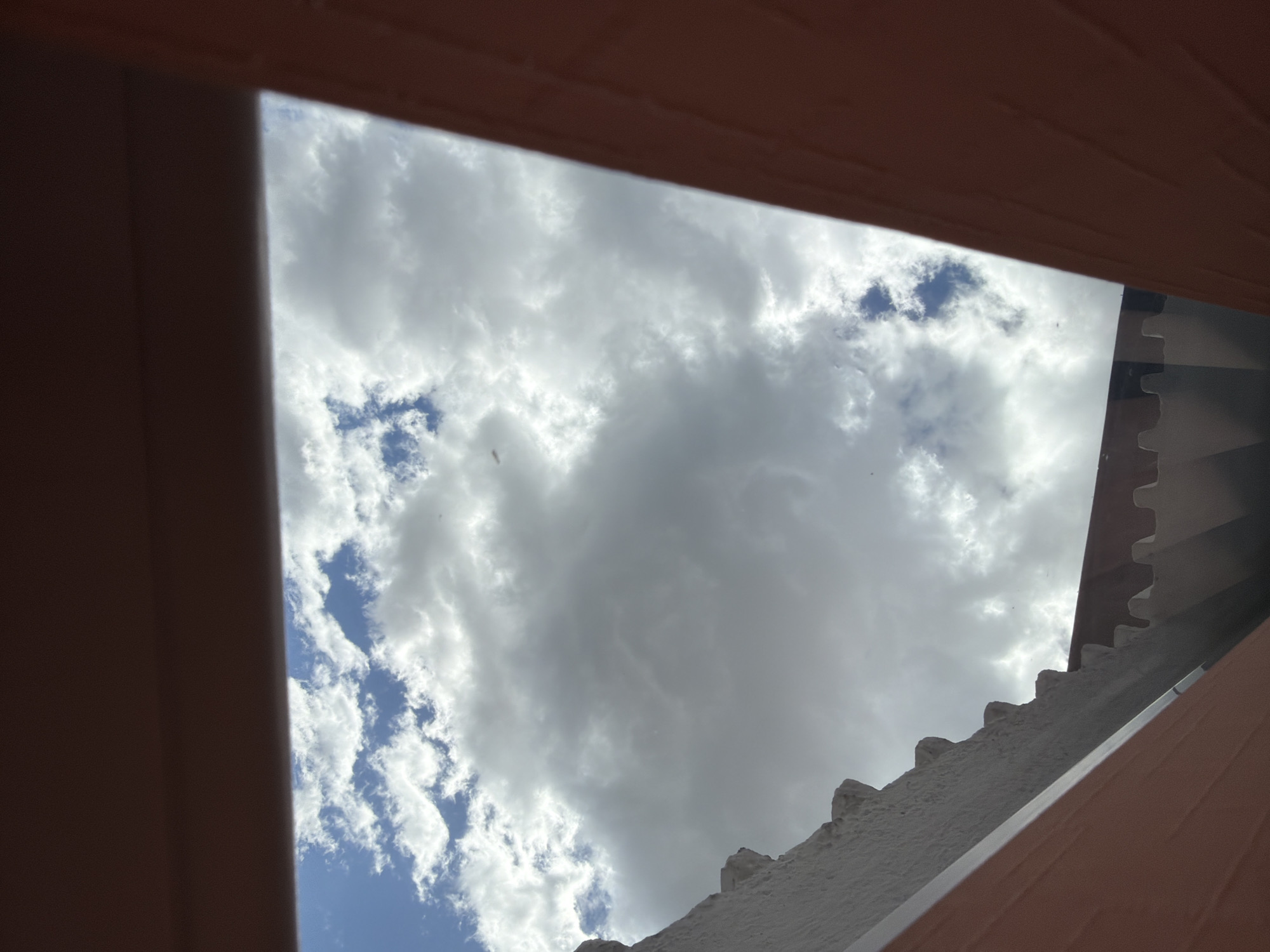 Morning sky viewed through building frames in Velingrad
