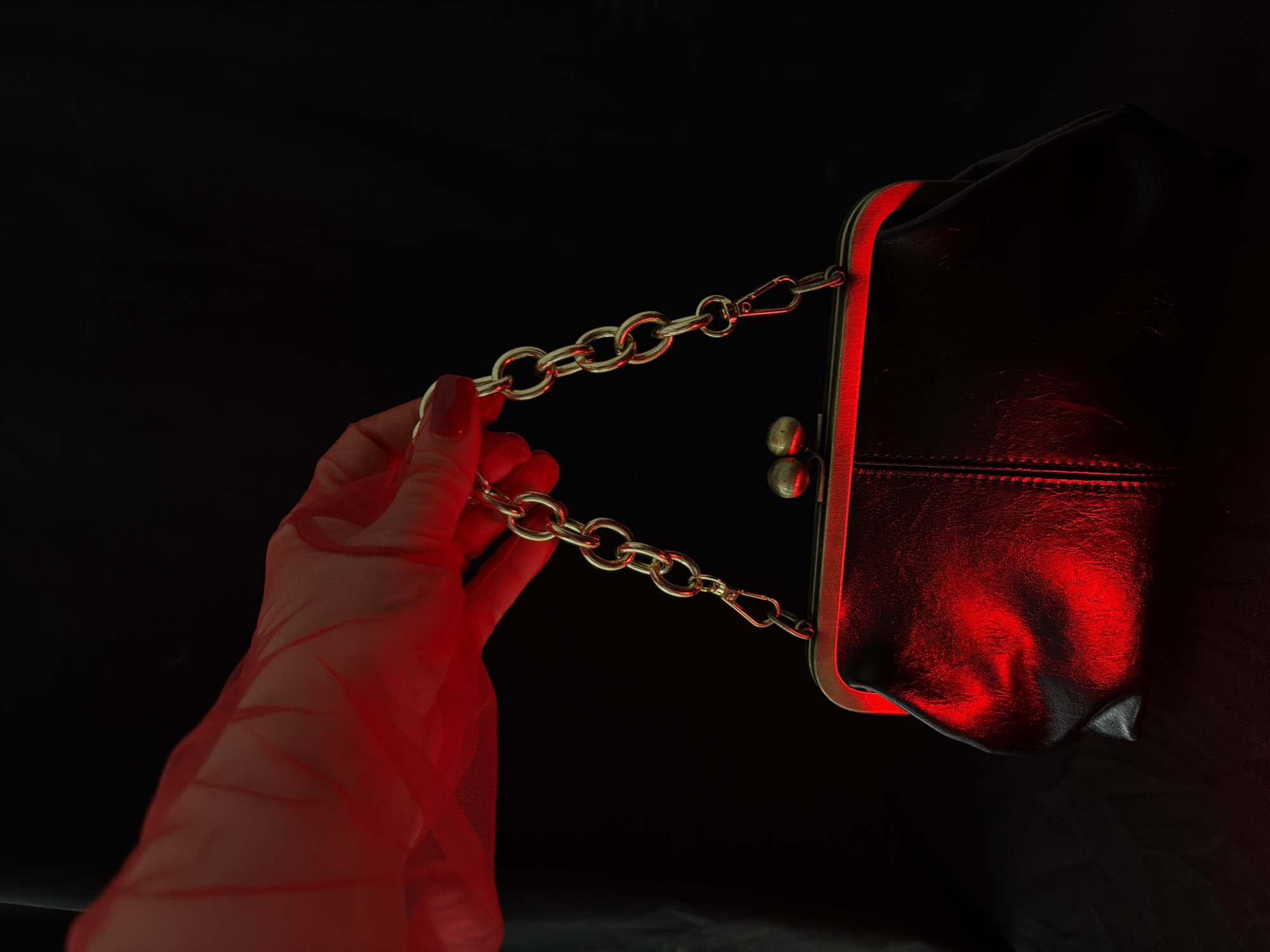 Mystical vintage accessories photographed with dramatic red lighting
