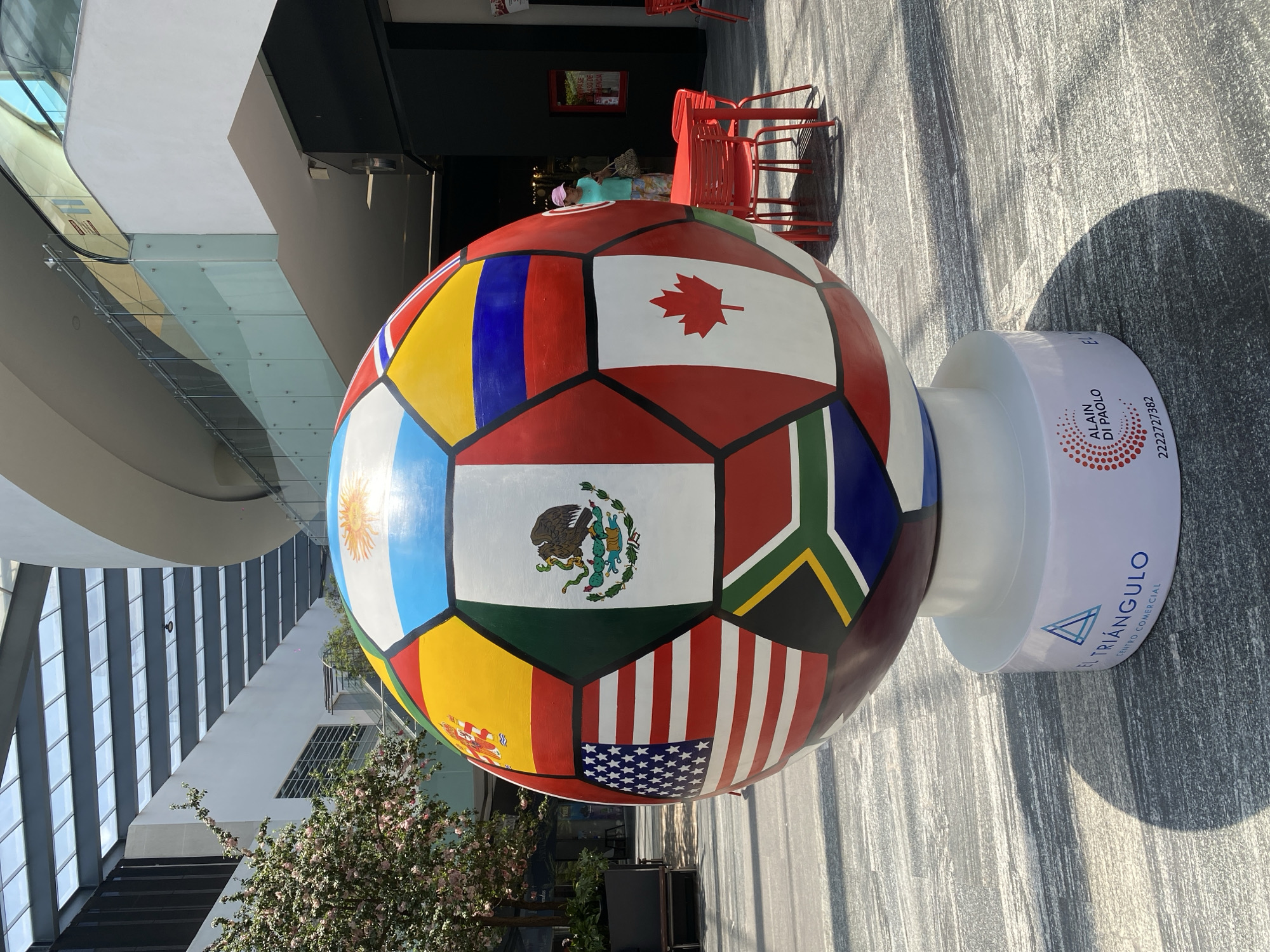 Indoor spaces documented: decorated soccer sculpture, ceiling windows, gym equipment