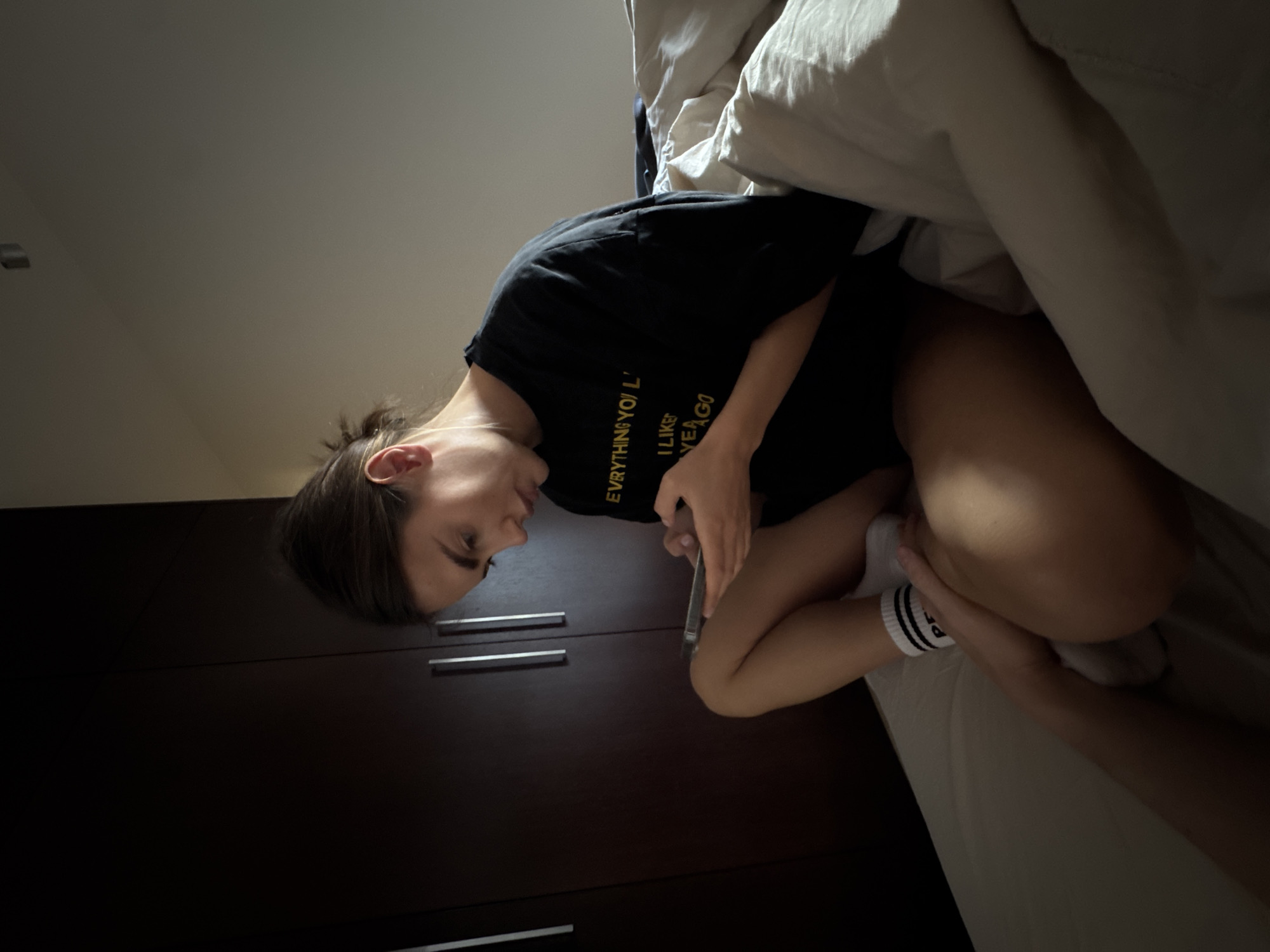 Person uses phone in Warsaw bedroom