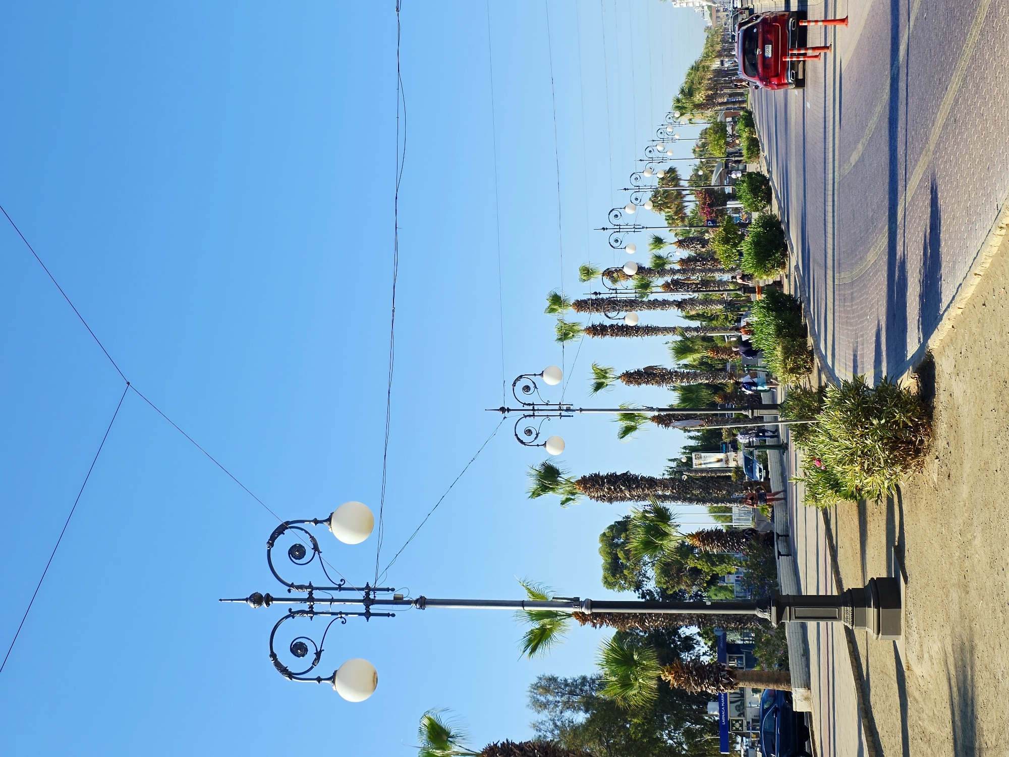 Larnaca's Finikoudes Promenade on a sunny summer morning