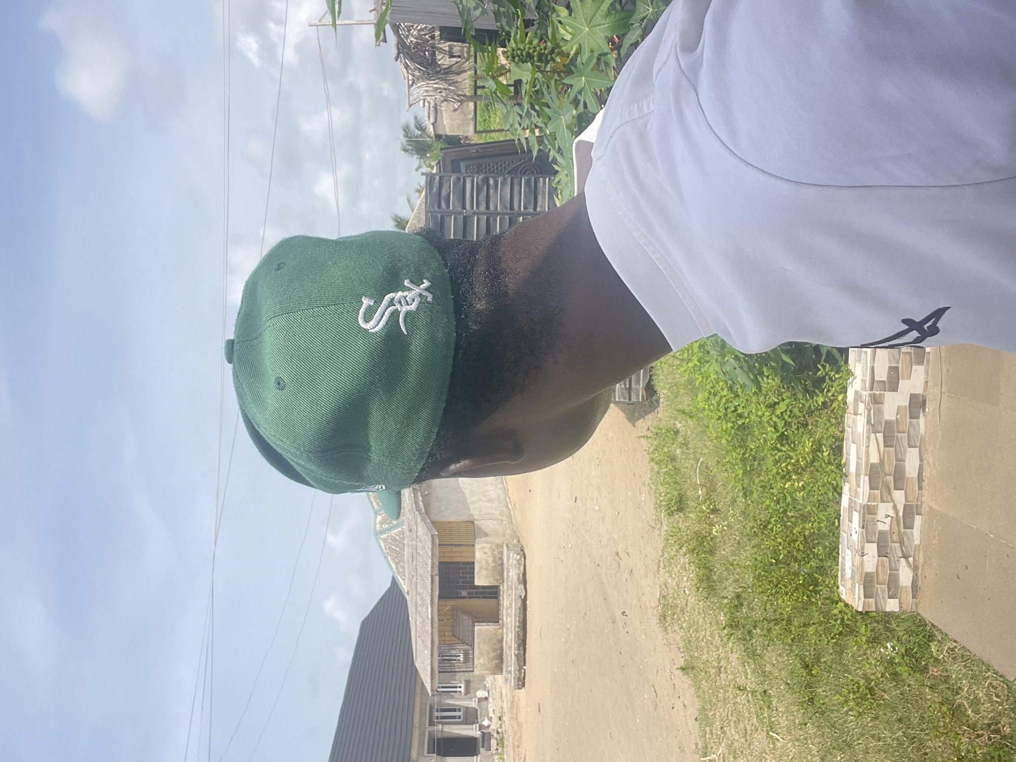 Young man photographed in multiple locations around Badagry, Nigeria