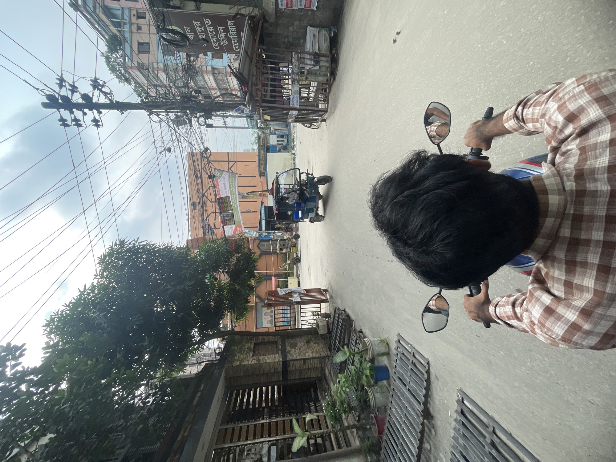 Late night motorcycle ride through Dhaka streets