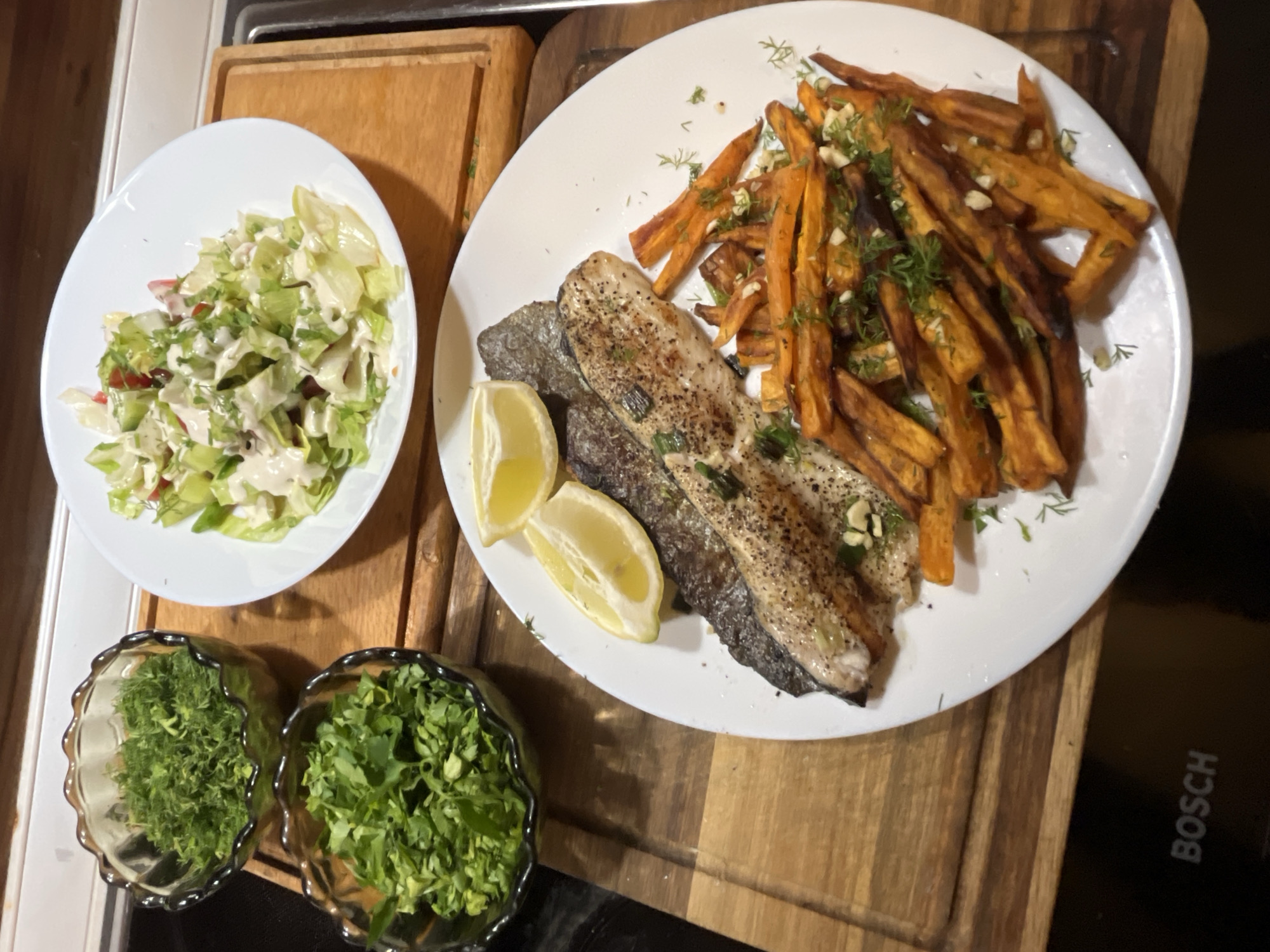 Evening meal preparation with fish and herbs in Sofia