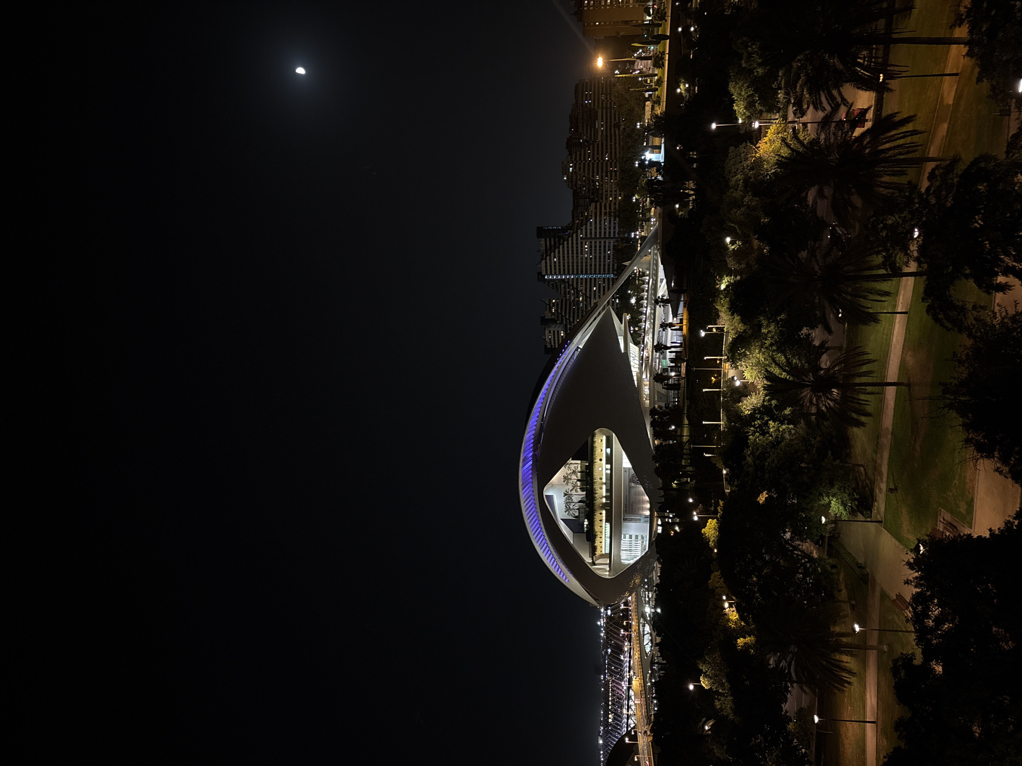 Valencia's Hemisfèric glowing at night, seen from multiple angles