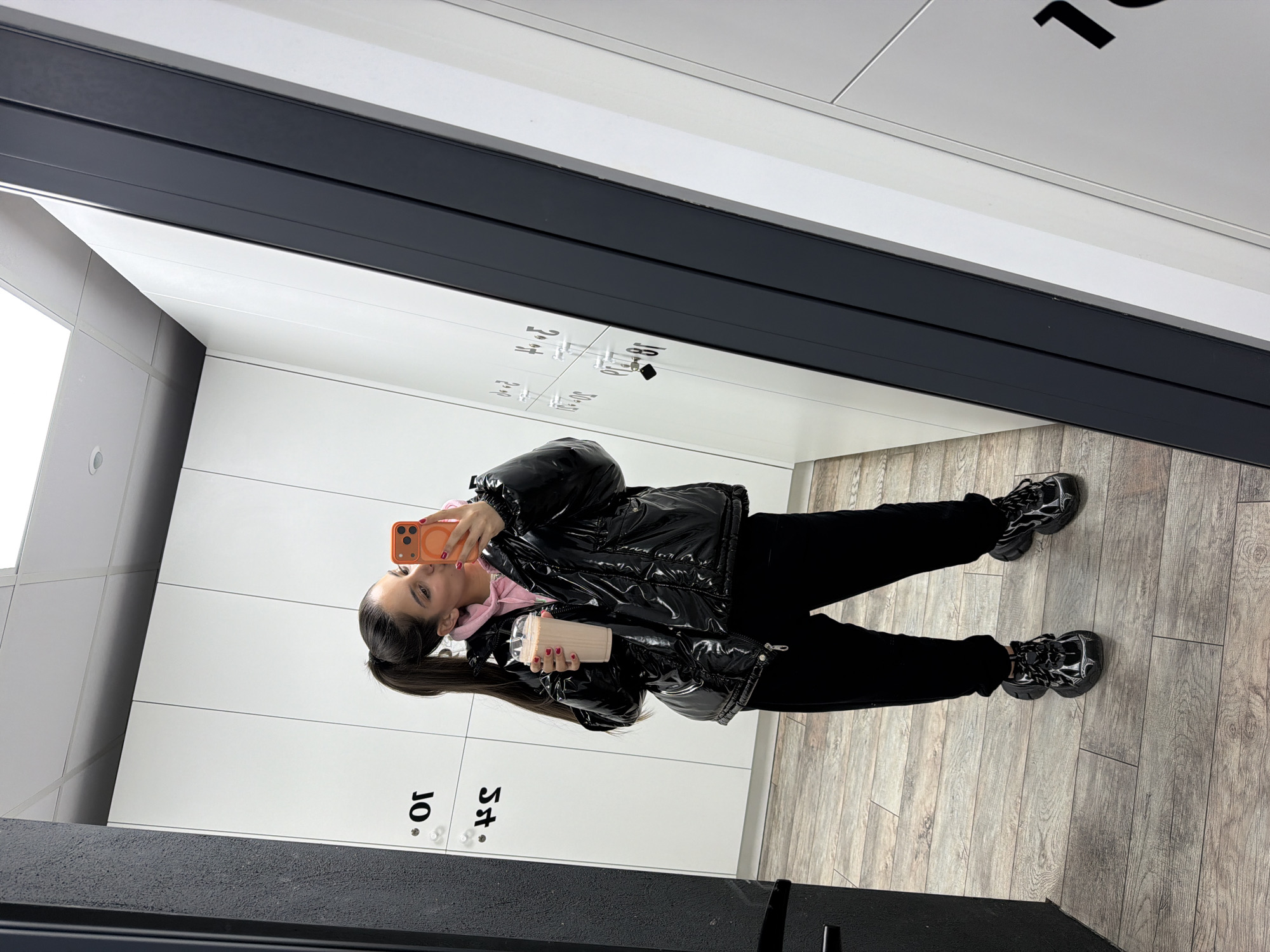 Woman takes selfies in Pernik locker room facility