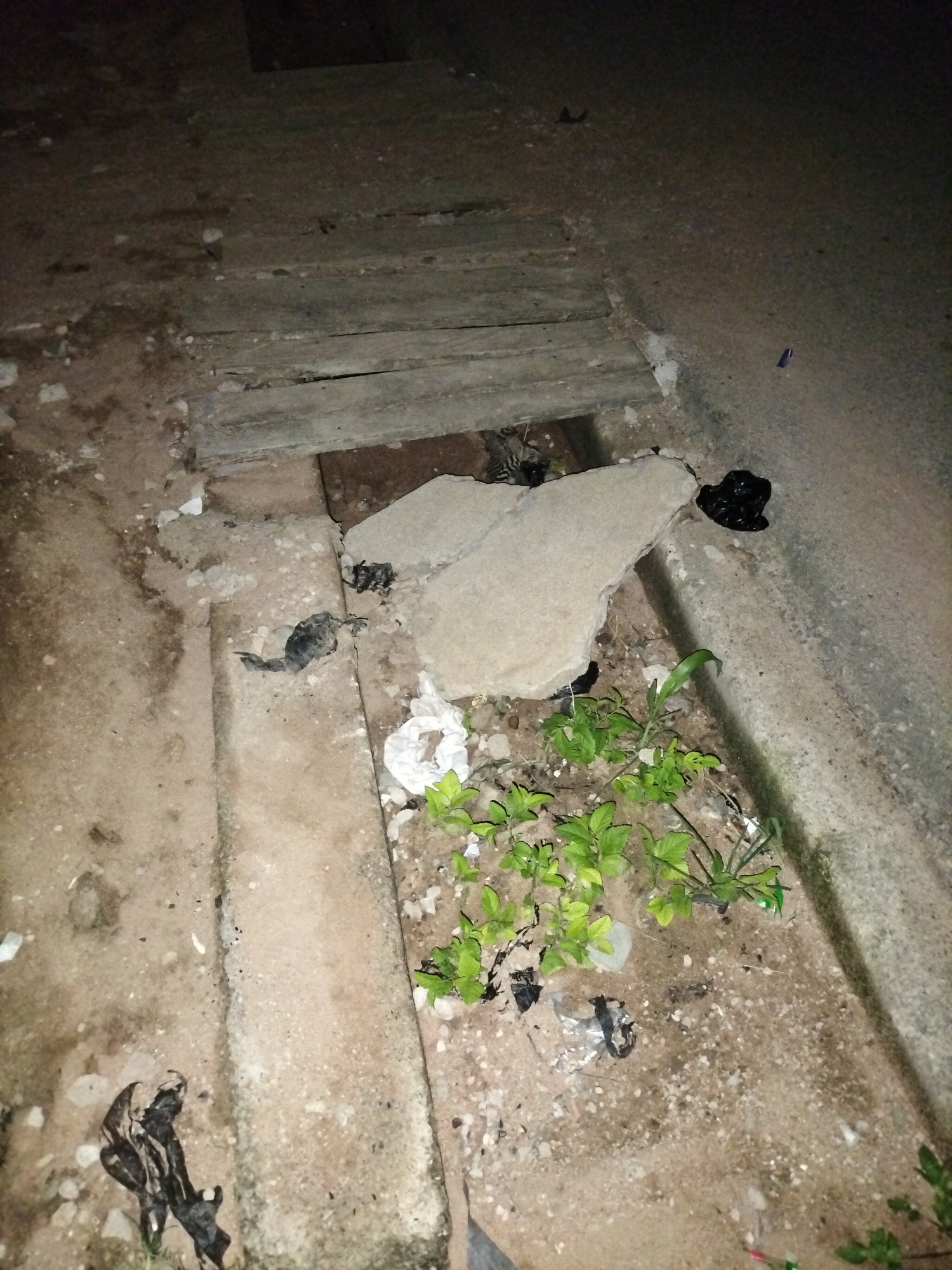 Nighttime documentation of urban Jalingo infrastructure and debris