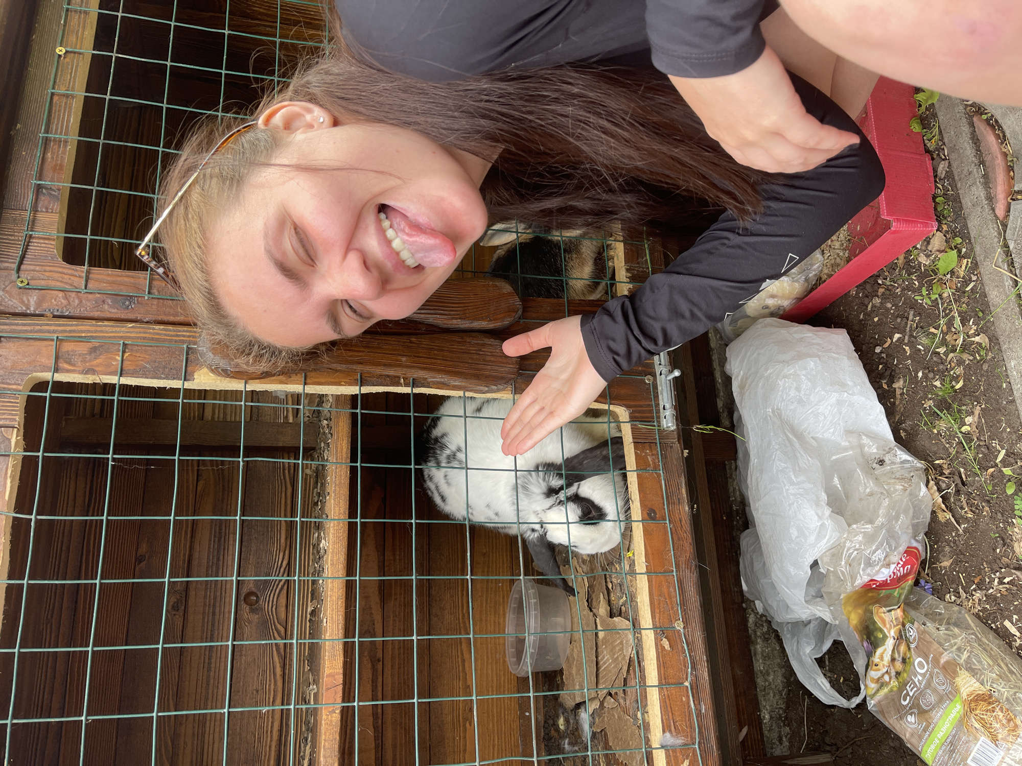 Woman visits rabbit enclosures at Molokovo waterfront