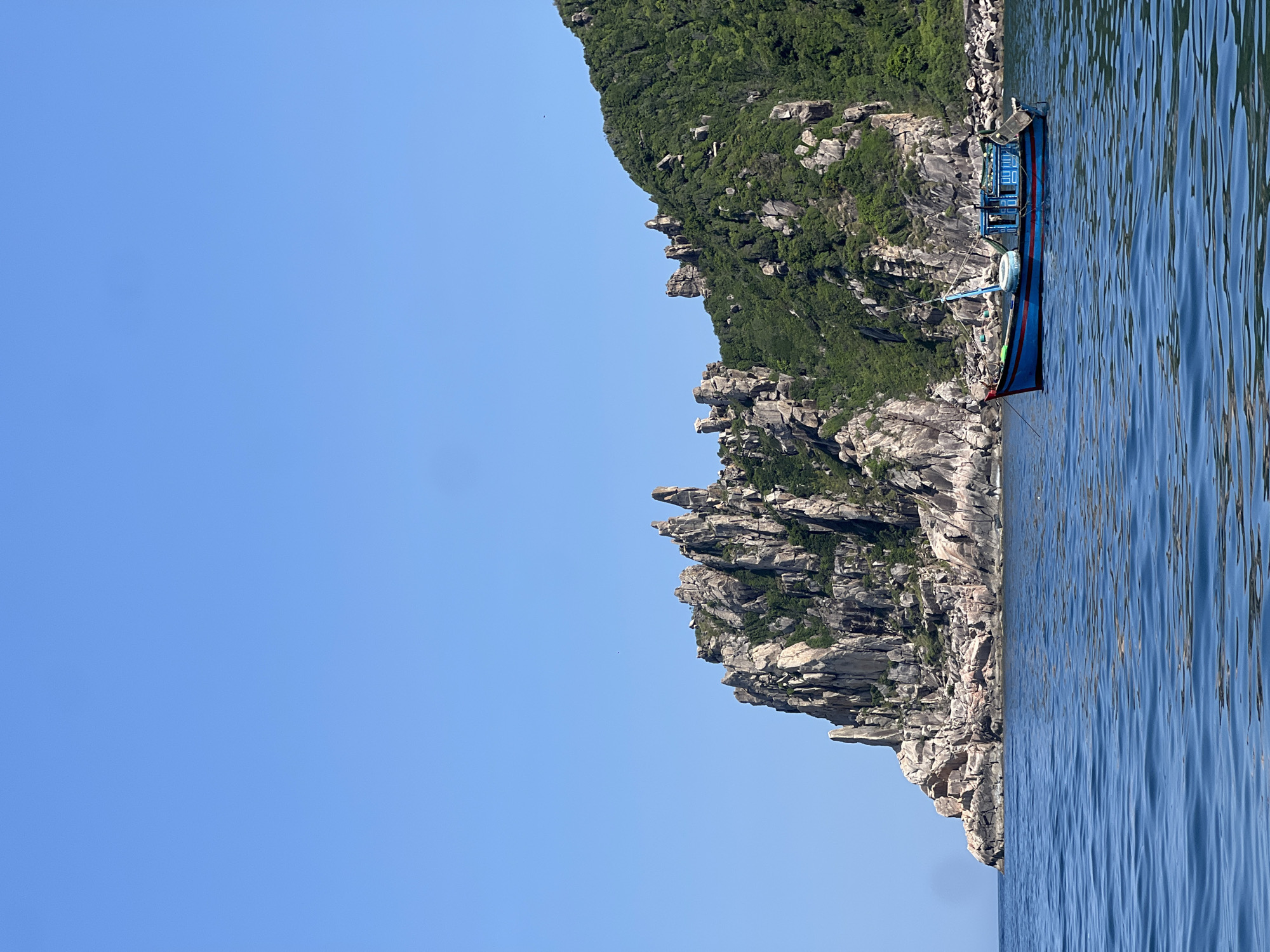 Boat day off the rugged coastline of Dai Lanh, Vietnam
