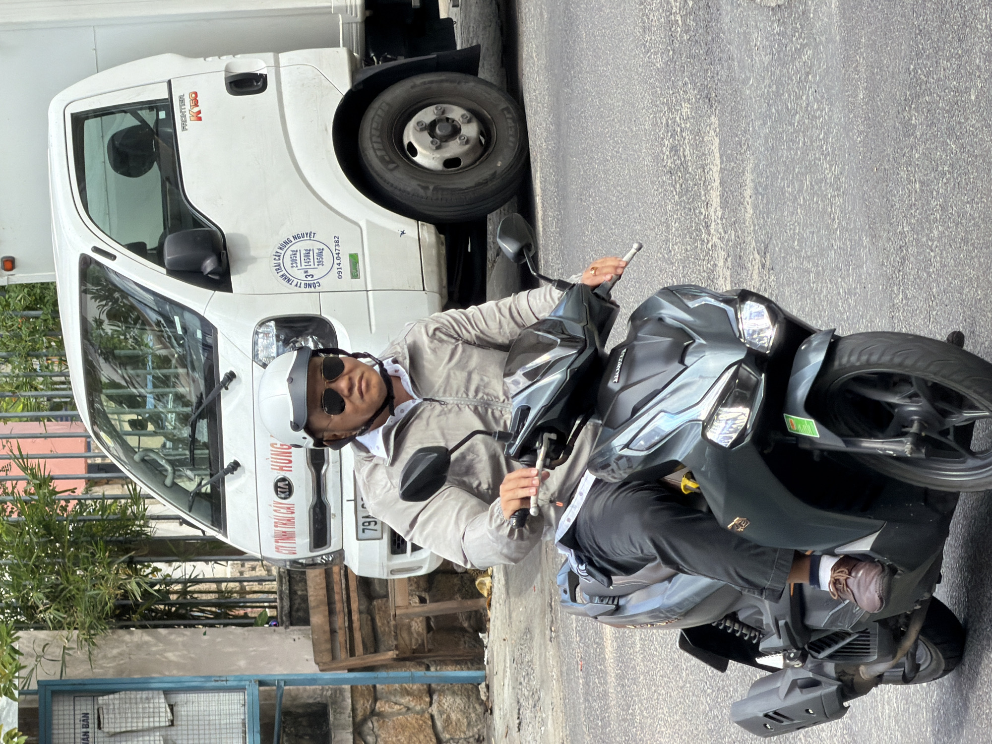 Morning motorcycle traffic on a Nha Trang street