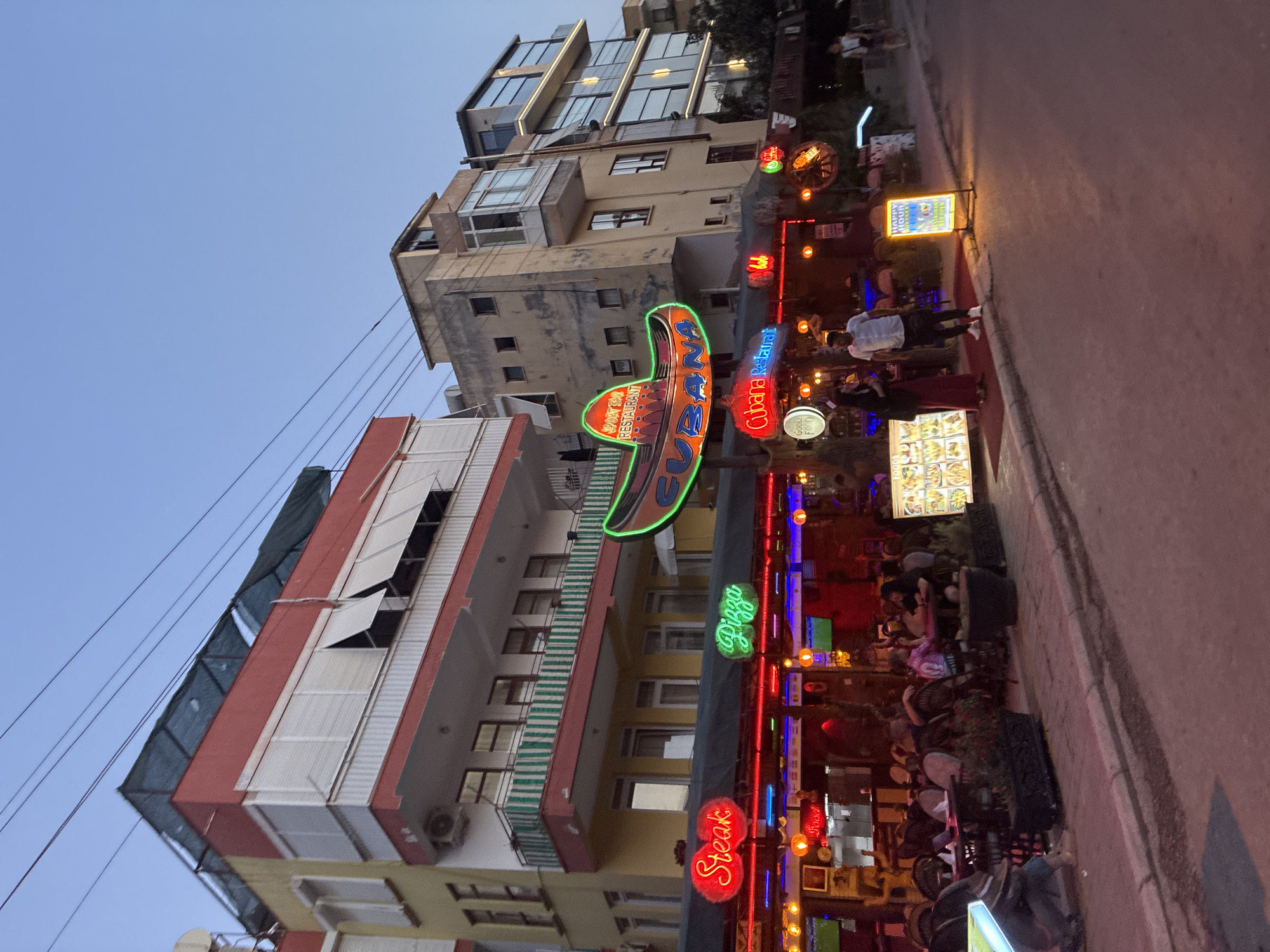 Alanya's neon-lit strip glows after evening rain