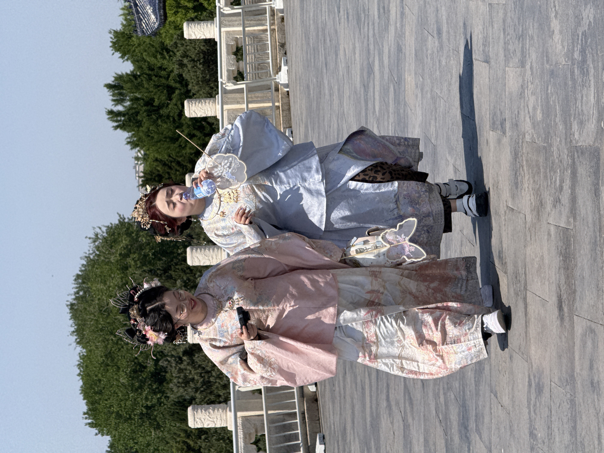 Two people in traditional dress spotted on Beijing walkway